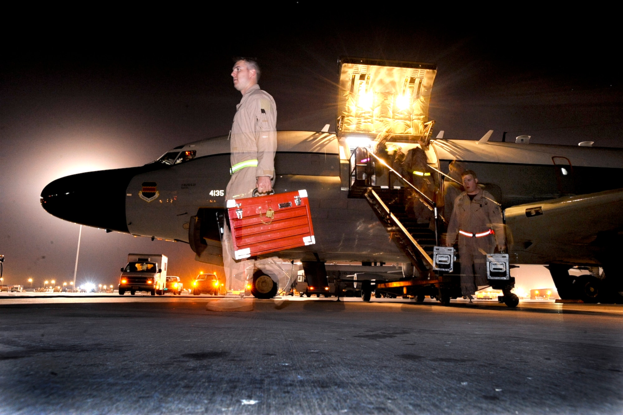 Members from the 763rd Expeditionary Reconnaissance Squadron exit an RC-135 Rivet Joint surveillance aircraft after returning from a mission on Jan. 5th, 2009, at an undisclosed location in Southwest Asia.  RC-135 Rivet Joint aircraft have maintained a constant presence in Southwest Asia since the early 1990s. The aircraft and crew are deployed from Offutt Air Force Base, Neb. in support of Operations Iraqi and Enduring Freedom and Combined Joint Task Force - Horn of Africa. (U.S. Air Force Photo by Staff Sgt. Joshua Garcia/released)