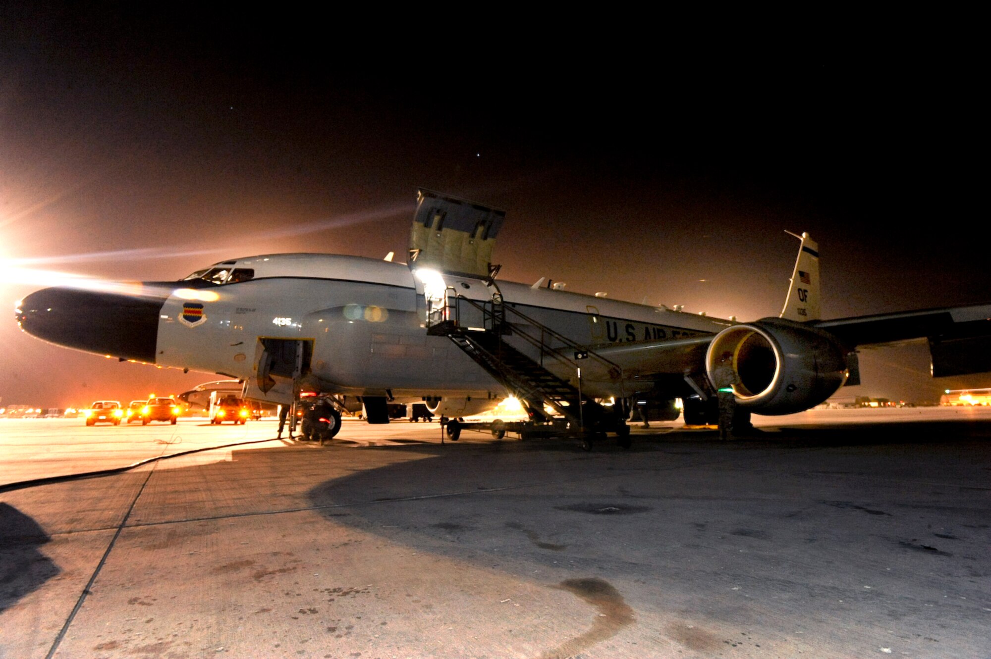 An RC-135 Rivet Joint surveillance aircraft from the 763rd Expeditionary Reconnaissance Squadron, stands on the flightline after returning from a mission on Jan. 5th, 2009, in an undisclosed location in Southwest Asia. The Rivet Joint reconnaissance aircraft provides near real time on-scene intelligence collection, analysis and dissemination capabilities in support of Operations Iraqi and Enduring Freedom and Combined Joint Task Force - Horn of Africa.  (U.S. Air Force Photo by Staff Sgt. Joshua Garcia/released)