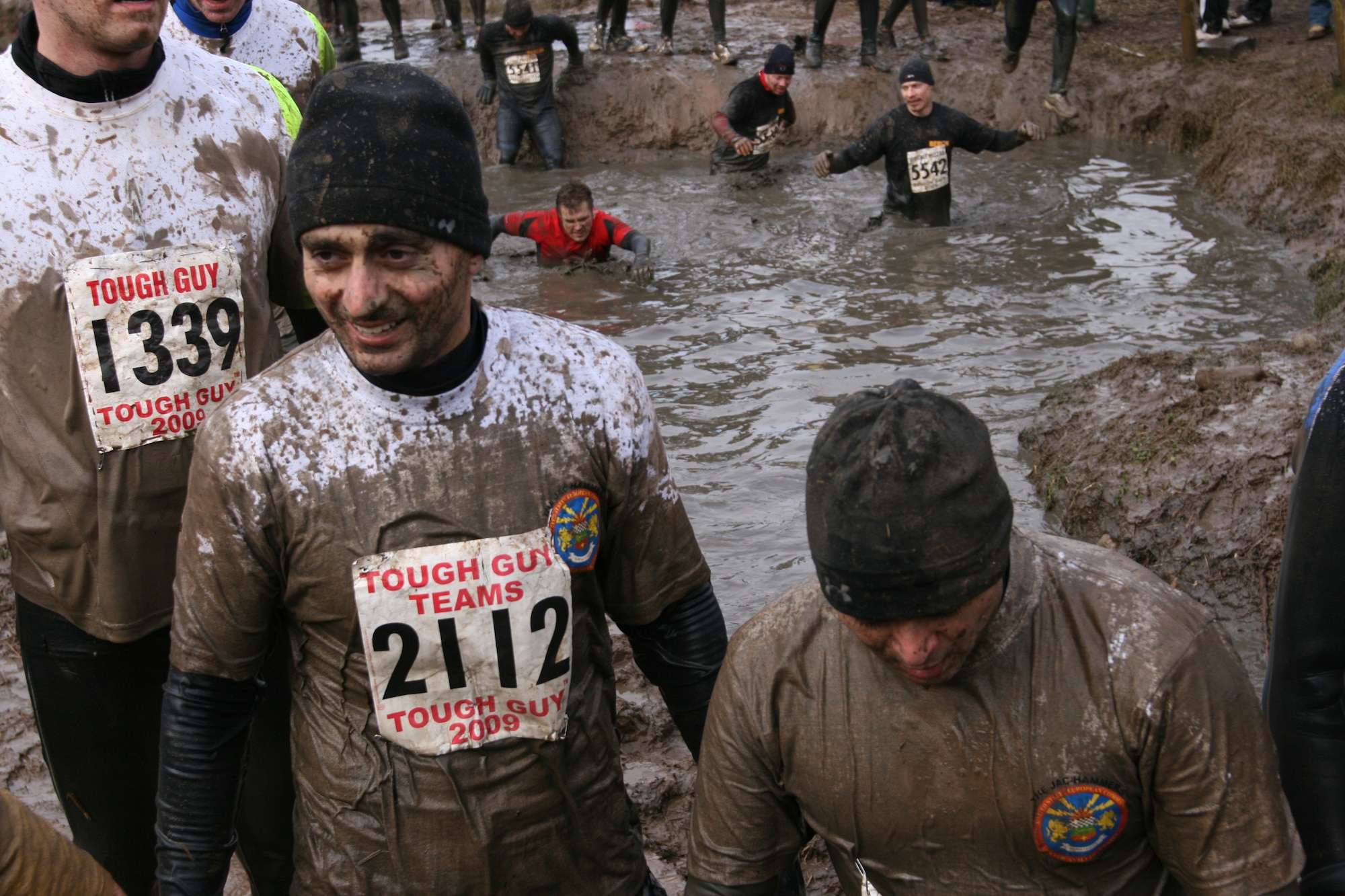 Navy Lieutenants Rahaghi and Lepesuastegui show the resutls of the first few obstacles during the February 1, 2009 Tough Guy Winter challenge called "The Brave and Beaufiful," in Perton England.  The two Lieutenants were part of the JAC HAMMERS team from RAF Molesworth.  (U.S. Air Force photo by Chief Petty Officer Keith Van Hoosen)