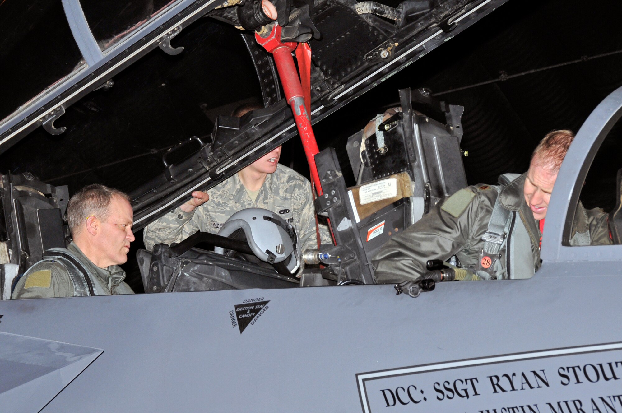 Maj. Tom Laitinen 494th Fighter Squadron F-15E Strike Eagle pilot and Maj. Gen. Mark T. Matthews, Director of Requirements, Headquarters Air Combat Command, a previous 48th Fighter Wing commander, gets strapped in into the F-15E and goes over the pre-flight checklist for his F-15E orientation flight with the 494th Fighter Squadron, Jan. 30 at RAF Lakenheath, England. (U.S. Air Force photo by Airman 1st Class Perry Aston)