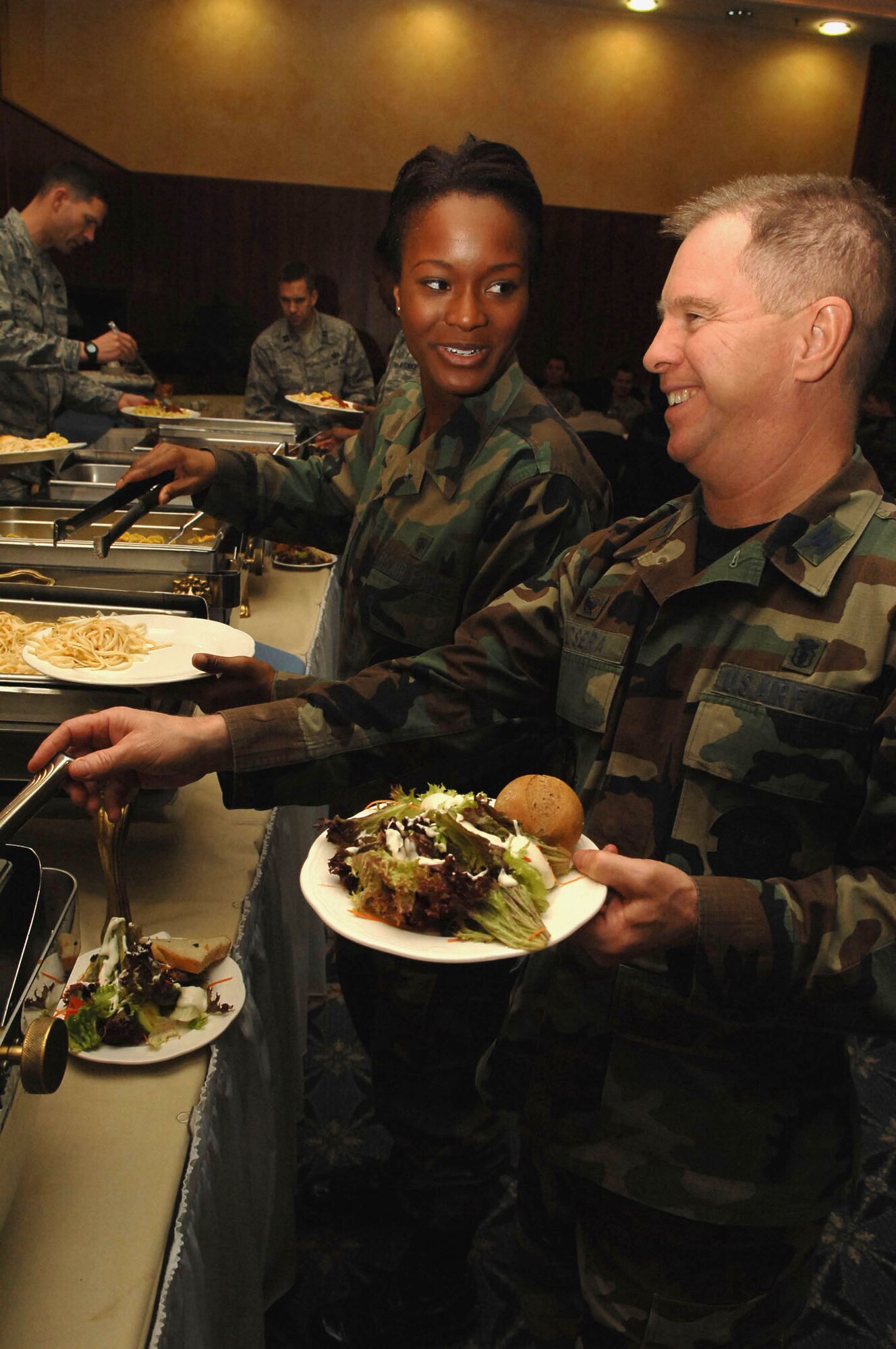 SPANGDAHLEM AIR BASE, Germany -- Col. Michael Kucsera, 52nd Dental Squadron commander, speaks with Senior Airman TaShana Price, a dental technician with the 52nd Dental Squadron, at the National Prayer Luncheon on Jan 30. The national prayer luncheon is an annual interface luncheon that recognizes the moral and religious values upon which the nation was founded. (U.S. Air Force photo by Airman 1st Class Nicholas Wilson)