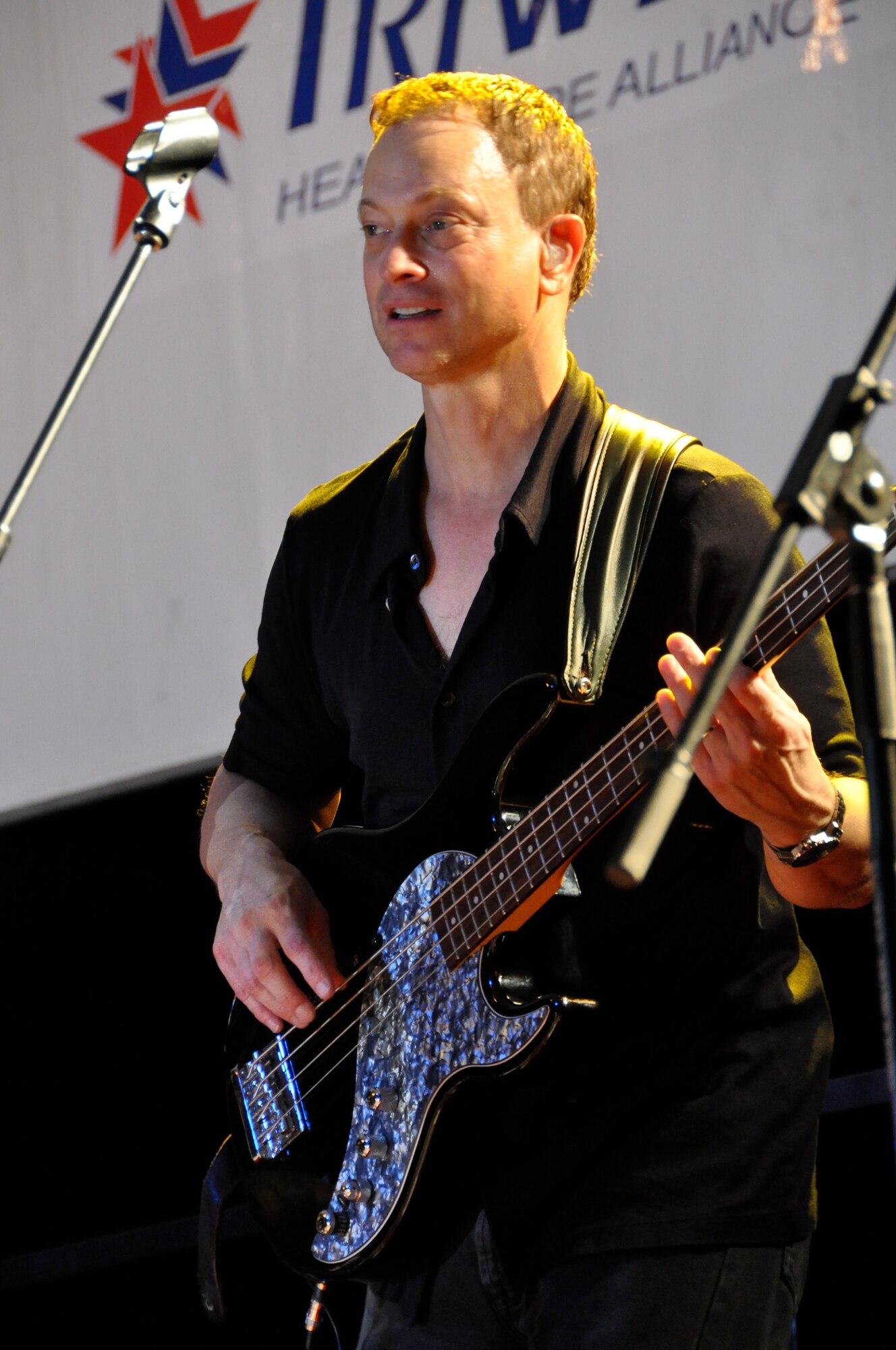 HICKAM AFB - CSI television show star and Blue Island, Ill. native Gary Sinise and his band, "Lt. Dan Ban" perform at Hickam Air Force Base, Hawaii on Jan. 31, 2009. Sinise and his "Lt. Dan Band" performed at Marine Corps Base Hawaii (MCBH) Kaneohe Bay on Jan 30, 2009 in addition to speaking to Hickam's Airmen and giving them a pep talk for their upcoming Operational Readiness Inspection (ORI). (U.S.  Air Force photo/Tech Sgt. Cohen A. Young) 