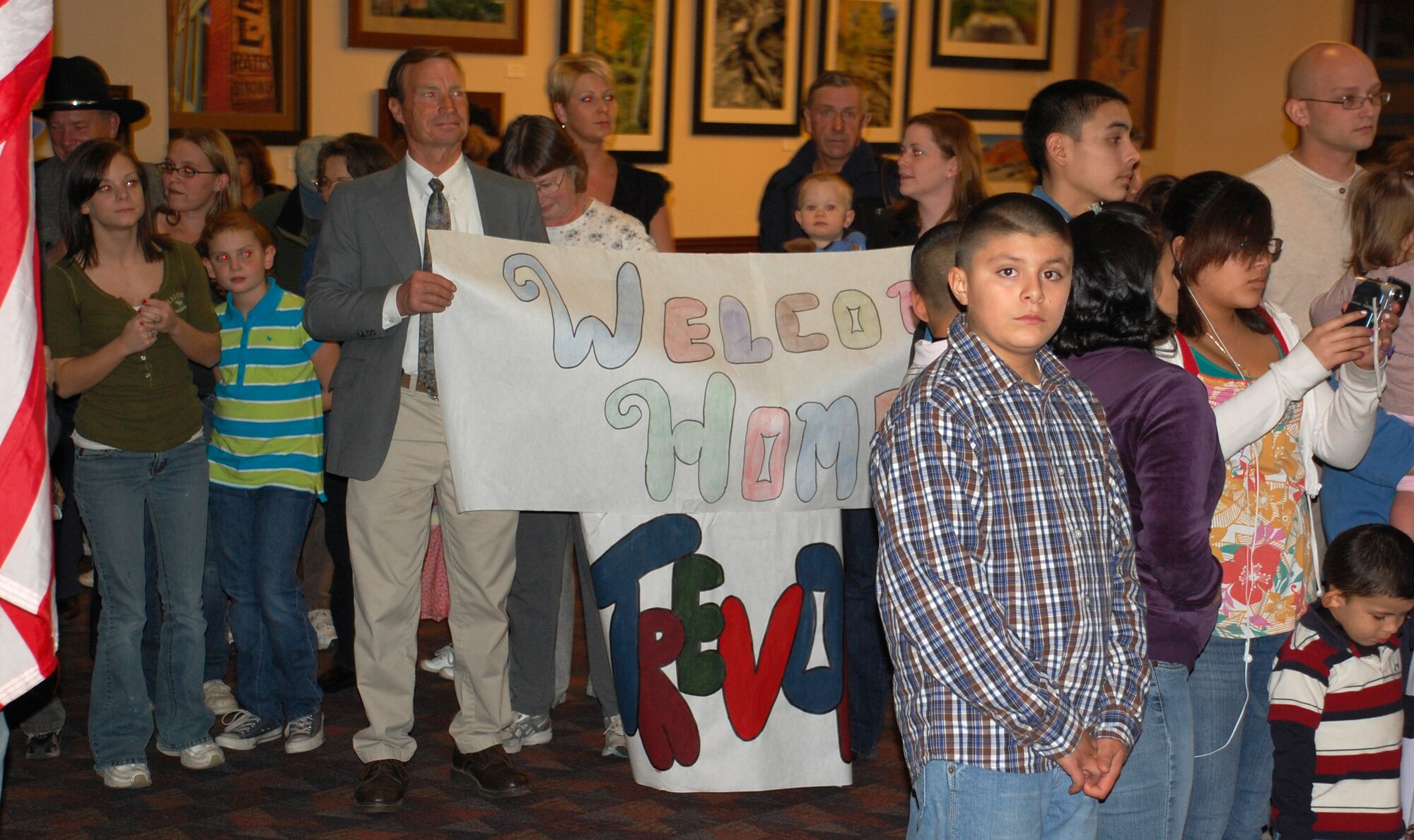 Family members of deployed 302nd Security Forces Squadron Airmen anxiously await the return of their loved ones Feb. 5, 2009, at the Colorado Springs Airport in Colorado. More than 35 Air Force Reserve security forces Airmen were deployed for six months to Kirkuk Regional Air Base, Iraq, in support of Operation Iraqi Freedom. The 302nd SFS is based at Peterson Air Force Base, Colo. (U.S. Air Force photo/Tech. Sgt. Daniel Butterfield)