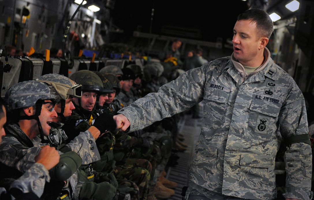 U.S. Air Force Capt. Jason Medsger motivates jumpers before a static line parachute jump out of a C-17 Globemaster III aircraft at Moody Air Force Base, Ga., Feb. 5, 2009. Medsger is assigned to the 820th Security Forces Group.
