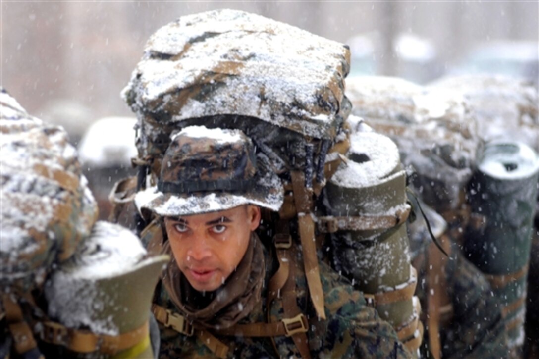 U.S. Marine Corps officer candidates assigned to Charlie Company brave winter weather conditions during a four-mile hike on Marine Corps Base Quantico, Va., Jan. 27, 2009. Candidates are evaluated on their leadership abilities and problem solving skills.