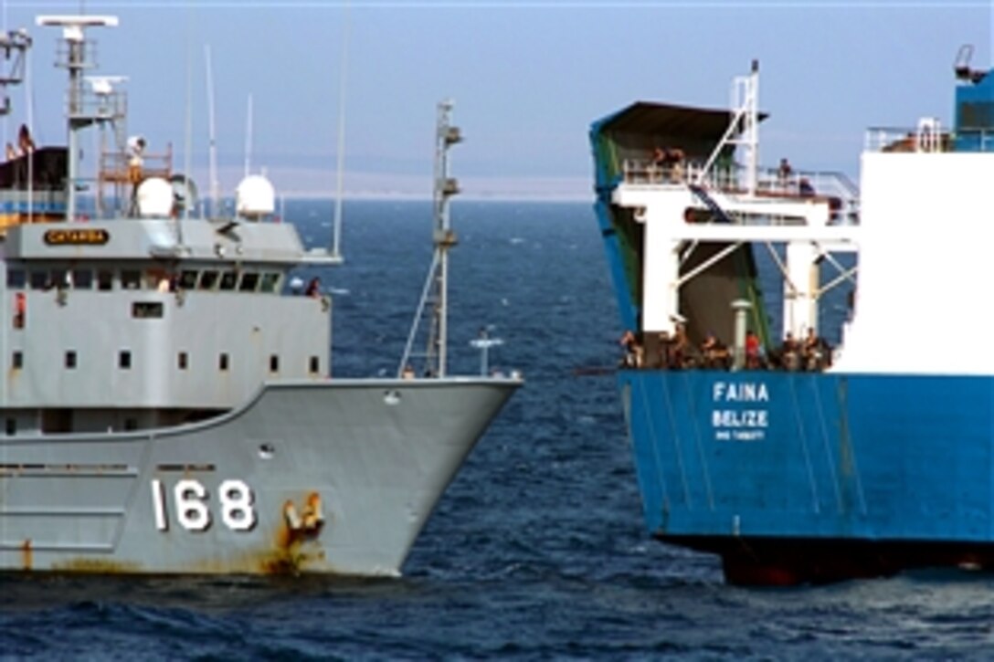 The U.S. Navy fleet ocean tug USNS Catawba provides fuel and fresh water to Ukrainian ship Faina following its release by Somali pirates, Feb. 5, 2009, after holding it for more than four months. The U.S. Navy has remained within visual range of the ship and maintained a 24-hour, 7-days a week presence since it was captured.