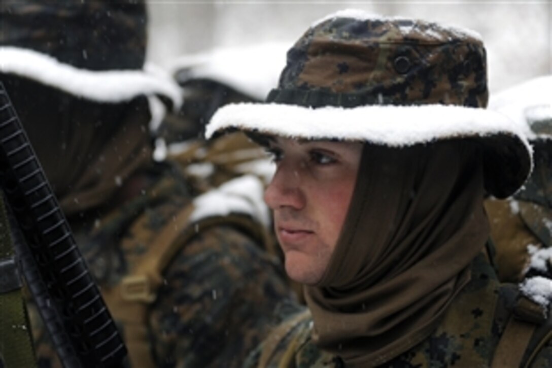 U.S. Marine Corps officer candidates assigned to Charlie Company brave winter weather conditions during a four-mile hike on Marine Corps Base Quantico, Va., Jan. 27, 2009. Candidates are evaluated on their leadership abilities and problem solving skills.