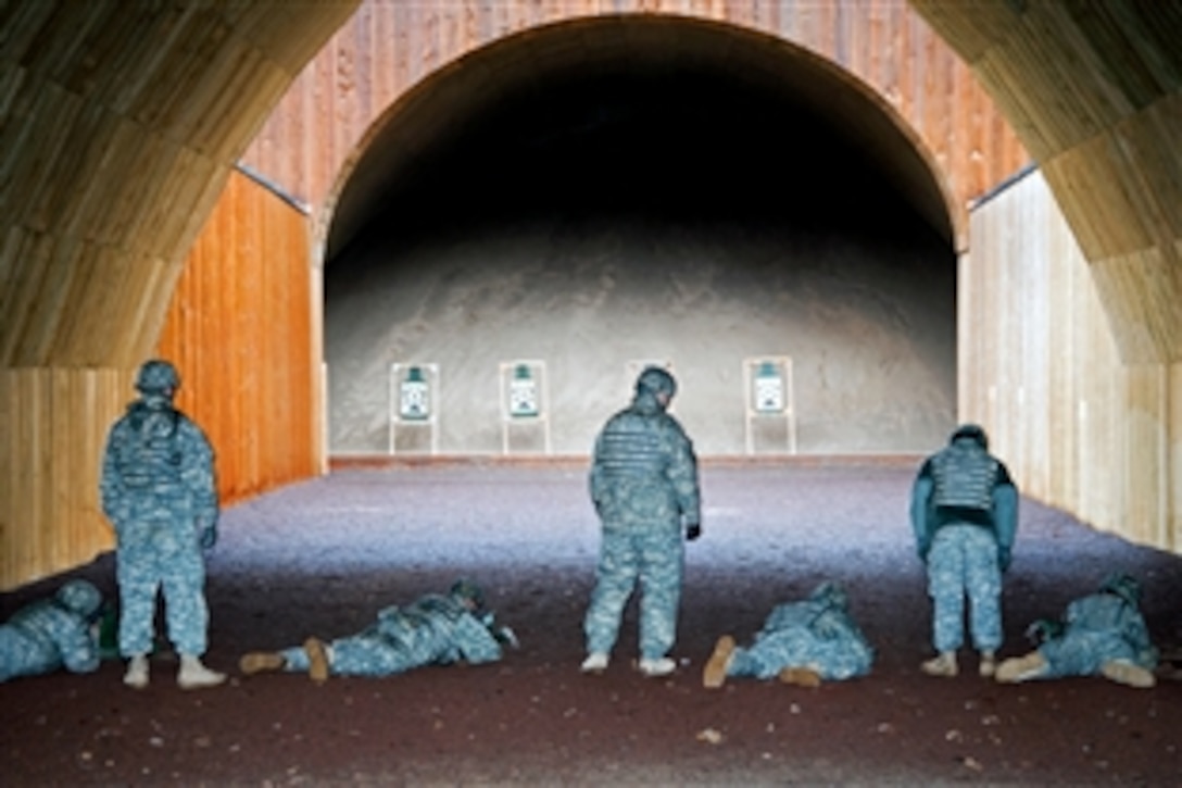 U.S. Army soldiers fire M16 weapons at the range complex in Stuttgart, Germany, Jan 23, 2009. The soldiers, assigned to the 554th Military Police Company, are preparing for an upcoming deployment.