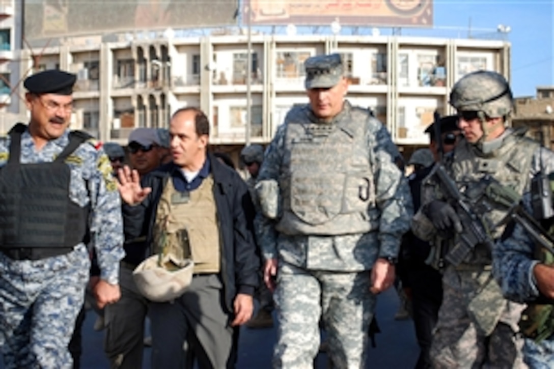 Iraqi Maj. Gen. Abdulkreem Abdulrahman Al-Izi, left, leads U.S. Army Gen. Raymond T. Odierno, commander of Multinational Force Iraq, and Lt. Col. Dave Buckingham inside the Matanabi Book Market in the Rusafa district of eastern Baghdad, Iraq, Feb. 4, 2009. Buckingham is commander of the 82nd Airborne Division's 5th Squadron, 73rd Cavalry Regiment, 3rd Brigade Combat Team.