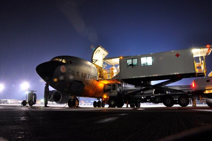 Sick and wounded troops are taken from a specialized transport vehicle onto a KC-135 Stratotanker at Bagram Airfield, Afghanistan. The KC-135 was manned by Airmen from the 931st Air Refueling Group who volunteered for a 12-day aeromedical evacuation mission that included four trips from Germany to Afghanistan. The 931st ARG is an Air Force Reserve unit at McConnell Air Force Base, Kan. (U.S. Air Force photo/Lt. Col. Tyoshi Tung)