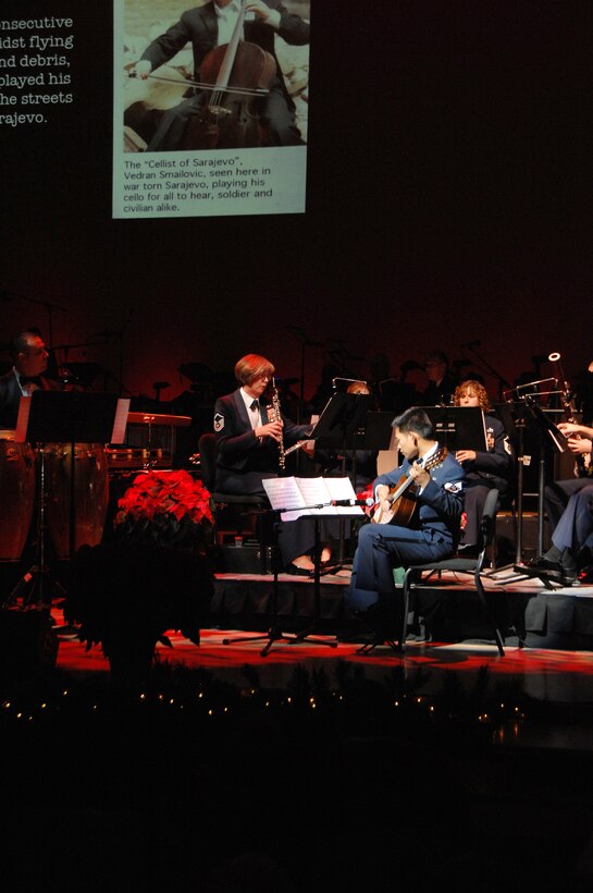 Guitarist Staff Sgt. Santos and the members of Winds of Freedom perform "Christmas Eve in Sarajevo" during the USAF Heartland of America Band's holiday show "The Promise of the Season."