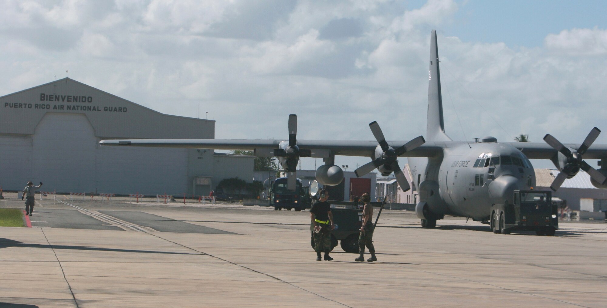 Members of the 302nd Maintenance Squadron tow a C-130 aircraft to its parking spot Dec. 12, 2008, where they later performed required inspections at Muniz Air National Guard Base in Puerto Rico. The Airmen were deployed in support of Operation Coronet Oak, a U.S. Southern Command-supported mission encompassing several missions, including the resupply of U.S. embassies, medical evacuation and support for U.S. troops in the region. (U.S. Air Force photo/Master Sgt. Heldwin Brito)