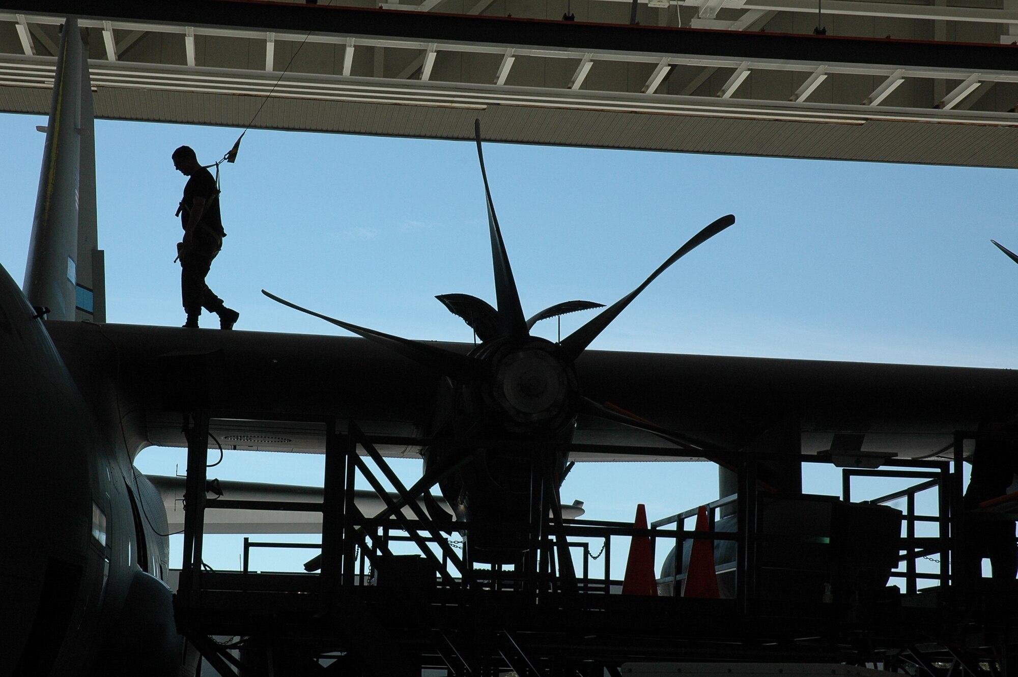 Senior Airman Dan Straka of the 403rd Maintenance Squadron walks across the wing  of a C-130 J model during an isochronal inspection of the aircraft. The inspections are conducted approximately every 180 days and provide maintainers an opportunity to thoroughly inspect the aircraft's systems.  