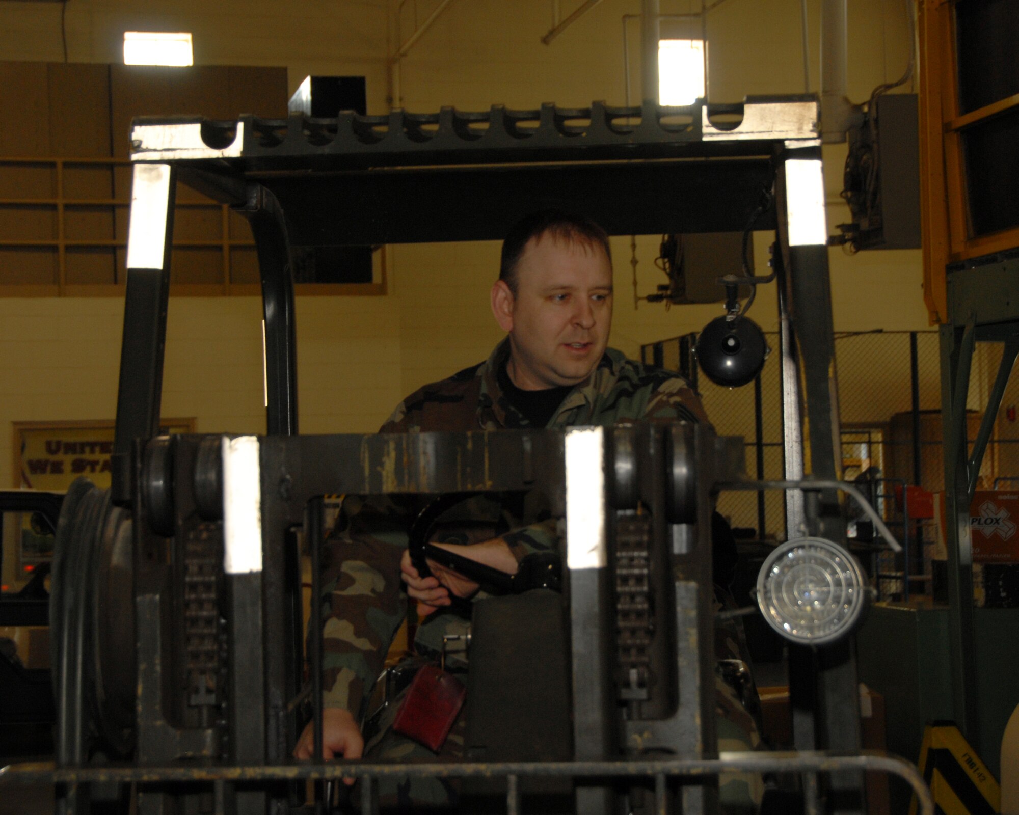 Technical Sgt. Clayton Herman, 185th Air Refueling Wing / Traffic Management Office, Sioux City, Iowa, Eyes a pallet that is ready to be moved. 
Official Air force photo by: Master Sgt. Bill Wiseman (Released)