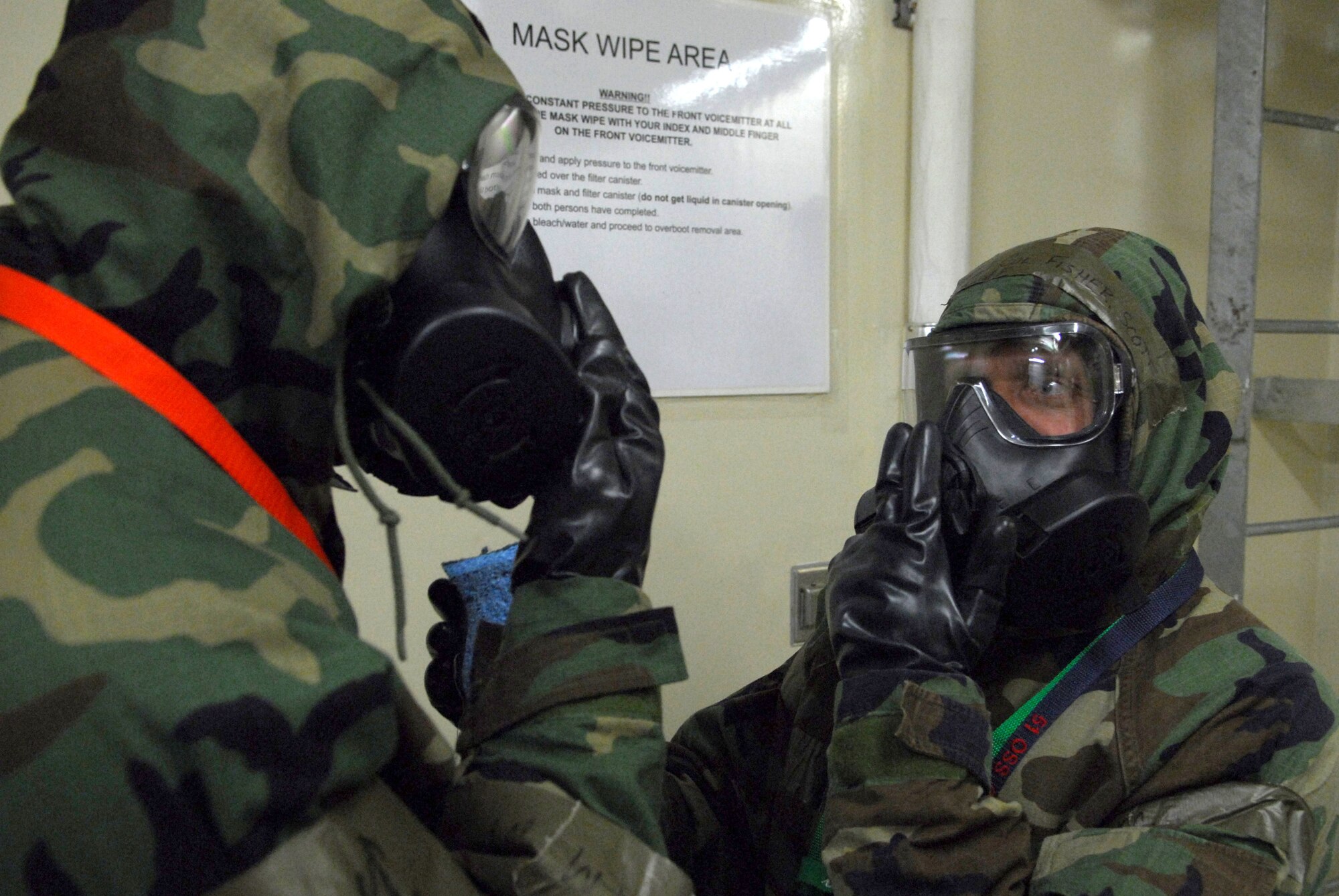 Airmen from the 51st Fighter Wing Emergency Operations center perform decontamination procedures during the 51 FW Operational Readiness Exercise Beverly Midnight 09-01 at Osan AB, Republic of Korea, Feb. 8. The exercise tests Team Osan's ability to survive and operate during a nuclear, biological, or chemical attack.  (U.S. Air Force Photo/Senior Airman Christopher Boitz)
 
