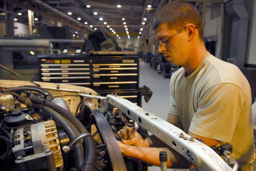 Staff Sgt. John Von Elling disassembles the cooling system of an ambulance during the 51st Fighter Wing’s Operational Readiness Exercise Beverly Midnight 09-01 at Osan AB, Republic of Korea, Feb. 8. The cooling system had to be removed to fix a bent push rod that was stuck in the engine head. Sergeant Von Elling is a vehicle maintainer with the 51st Logistic Readiness Squadron.  (U.S. Air Force Photo/Senior Airman Christopher Boitz)
 
