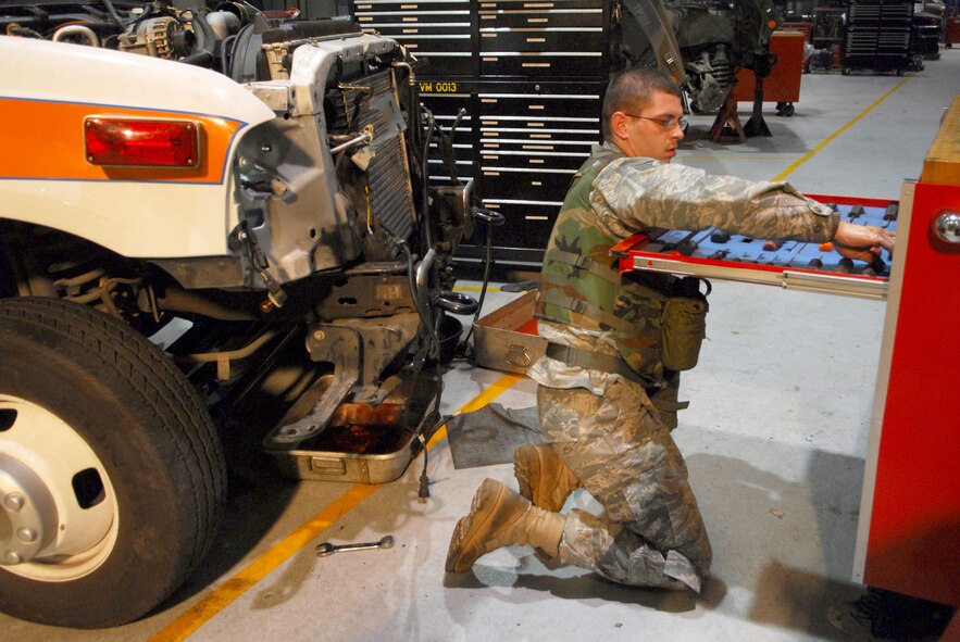 Staff Sgt. John Von Elling accounts for tools prior to disassembling the cooling system of an ambulance during the 51st Fighter Wing’s Operational Readiness Exercise Beverly Midnight 09-01 at Osan AB, Republic of Korea, Feb. 8. The cooling system had to be removed to fix a bent push rod that was stuck in the engine head.  Sergeant Von Elling is a vehicle maintainer with the 51st Logistic Readiness Squadron. (U.S. Air Force Photo/Senior Airman Christopher Boitz)