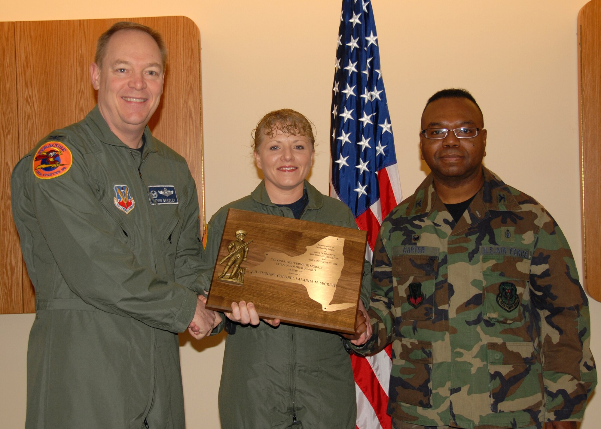 Lt. Col. (Dr.) Lalainia M. Secreti of the 174th Fighter Wing Medical Group is awarded the New York State "Colonel Gouverneur Morris Citizen Soldier Award" by the 174th Fighter Wing Comander Col. Kevin Bradley and 174th Fighter Wing Medical Group Commander Col. (Dr.) Wenzell Carter