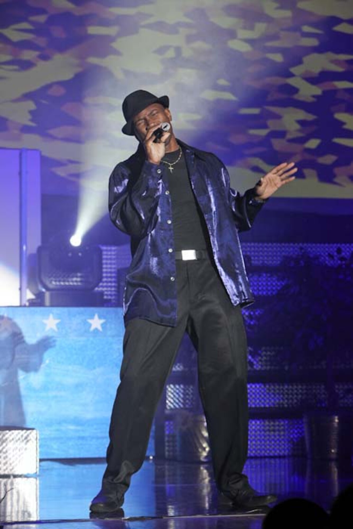 LACKLAND AIR FORCE BASE, Texas -- Staff Sgt. Wendell Boone a citizen Airman air transportation technician with the 69th Aerial Port Squadron takes center stage at the Worldwide Talent Contest Jan 19. Sergeant Boone was awarded a "Wilco" award for placing second in the male-vocalist category. (Courtesy photo)