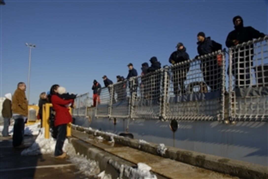 Family and friends of the crew of the 270-foot Coast Guard Cutter Seneca wait for the ship to moor pierside in Boston, Mass., Feb. 5, 2009, following the ship's one-month law enforcement patrol to the Caribbean. During the deployment, the crew rescued more than 400 migrants from unseaworthy vessels and prevented them from illegally entering the United States. The crew also provided food, water, shelter and medical care to the migrants before repatriating them to Haiti. 
