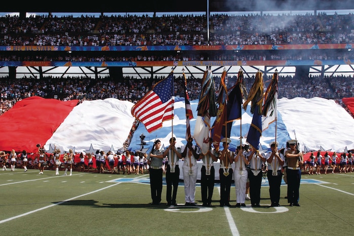 A joint-service color guard stands centerfield in front of tens of thousands of people during the playing of the Star Spangled Banner to kick off the 2009 Pro Bowl at Aloha Stadium Feb. 8.