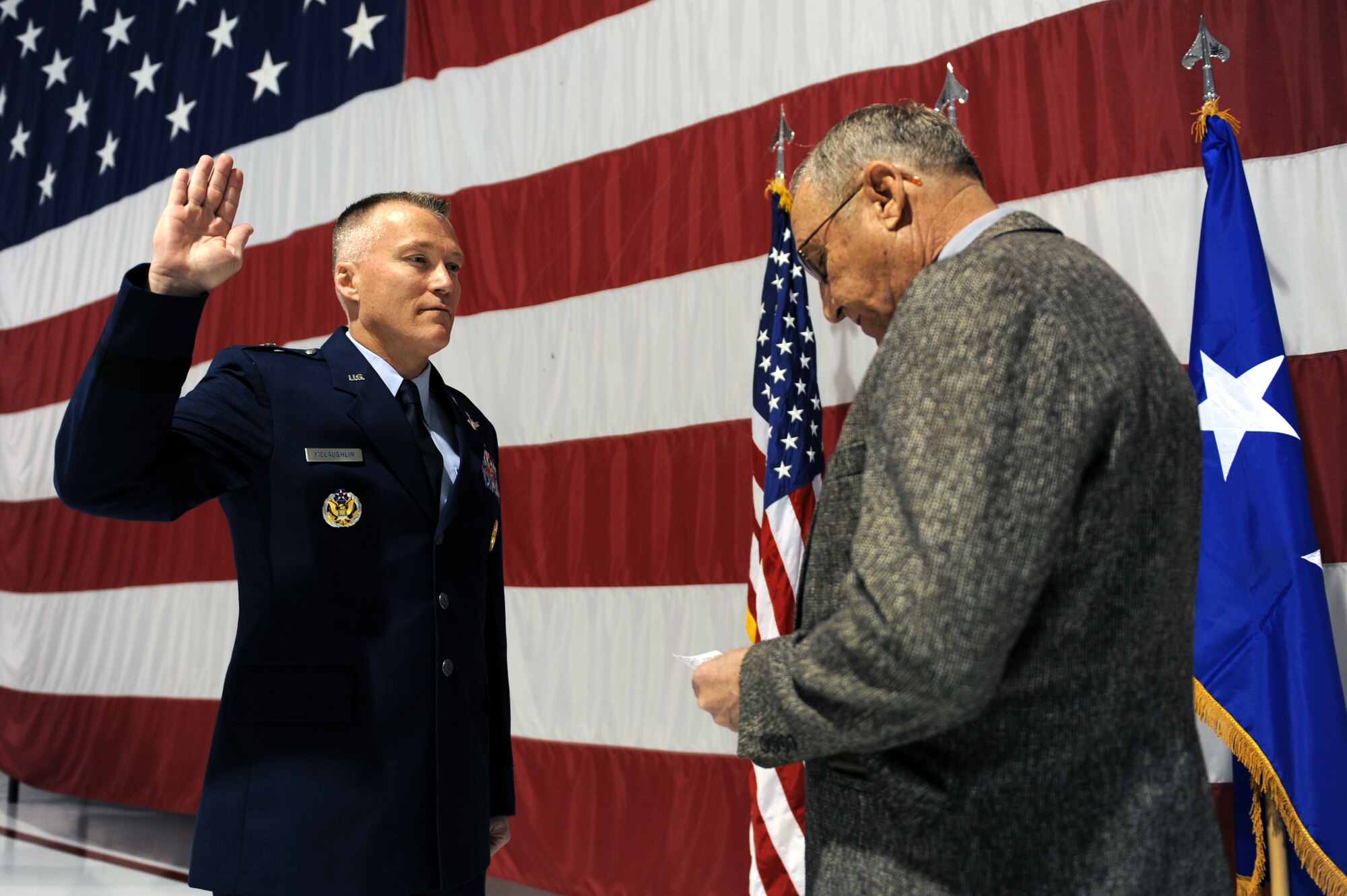 The United States Air Force Warfare Center vice-commander, Brig. Gen. Kevin McLaughlin takes the Oath of Office from retired Lt. Col. Marshall Patterson in the Thunderbird hangar at Nellis AFB, Nev., Feb. 6. The Oath of Office is taken to reaffirm one's  duty or following a promotion. (U.S. Air Force photo by Airman 1st Class Brett Clashman)

 

