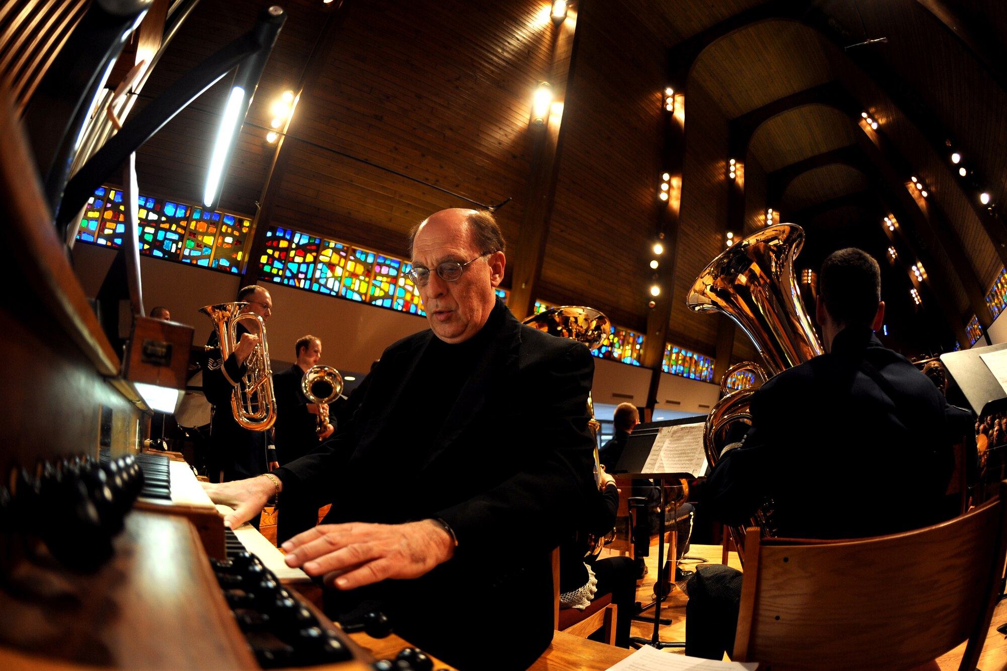 OFFUTT AIR FORCE BASE, Neb. -- Dana Sloan, Minister of Music at the Presbyterian Church of the Cross, is invited to play the organ with the Brass in Blue Ensemble, Heartland of America Band, for the final act of a concert also featuring chamber music from the University of Omaha band members.  This public concert was one of a concert series hosted by the church to celebrate their 20th season of concerts.

U.S. Air Force Photo by Josh Plueger