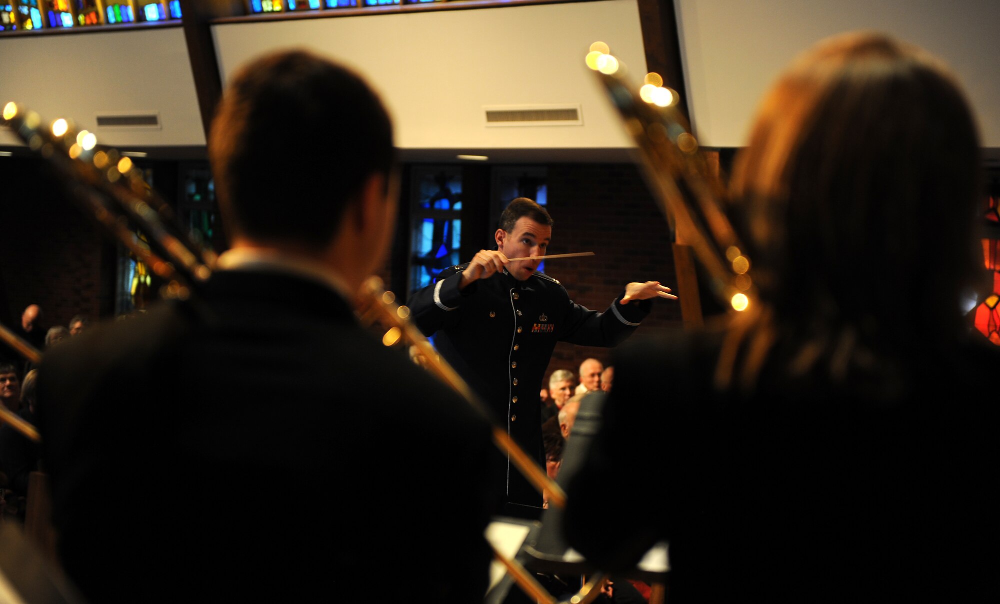 OFFUTT AIR FORCE BASE, Neb. -- Capt Michael J. Willen, commander, Heartland of America Band conducts the final song in a concert held at the Presbyterian Church of the Cross, Omaha, Feb. 8. The concert featured eight members from the University of Omaha Band and was one of a concert series hosted by the church to celebrate their 20th season of concerts.

U.S. Air Force Photo by Josh Plueger