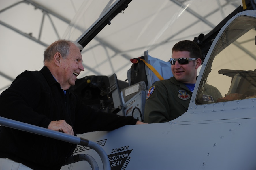 MOODY AIR FORCE BASE, Ga. -- Jack Hild, 23rd Fighter Group World War II veteran, receives an A-10C Thunderbolt II aircraft briefing from Capt. Jarret Biggers, 74th Fighter Squadron pilot, during a visit here Jan. 30. During his visit, he met several current-day Flying Tiger members from the 74th Fighter Squadron. (U.S. Air Force photo by Senior Airman Gina Chiaverotti)