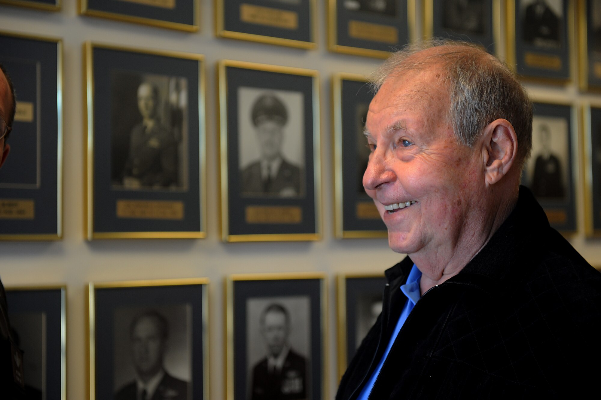 MOODY AIR FORCE BASE, Ga. -- Jack Hild, of the Lt. Gen. Claire Lee Chennault Foundation of Flying Tigers, looks at the 23rd Fighter Group’s former commanders photos on the wall during a visit here Jan. 30. Mr. Hild served as a Flying Tiger intelligence gathering Airman during World War II. (U.S. Air Force photo by Senior Airman Gina Chiaverotti)