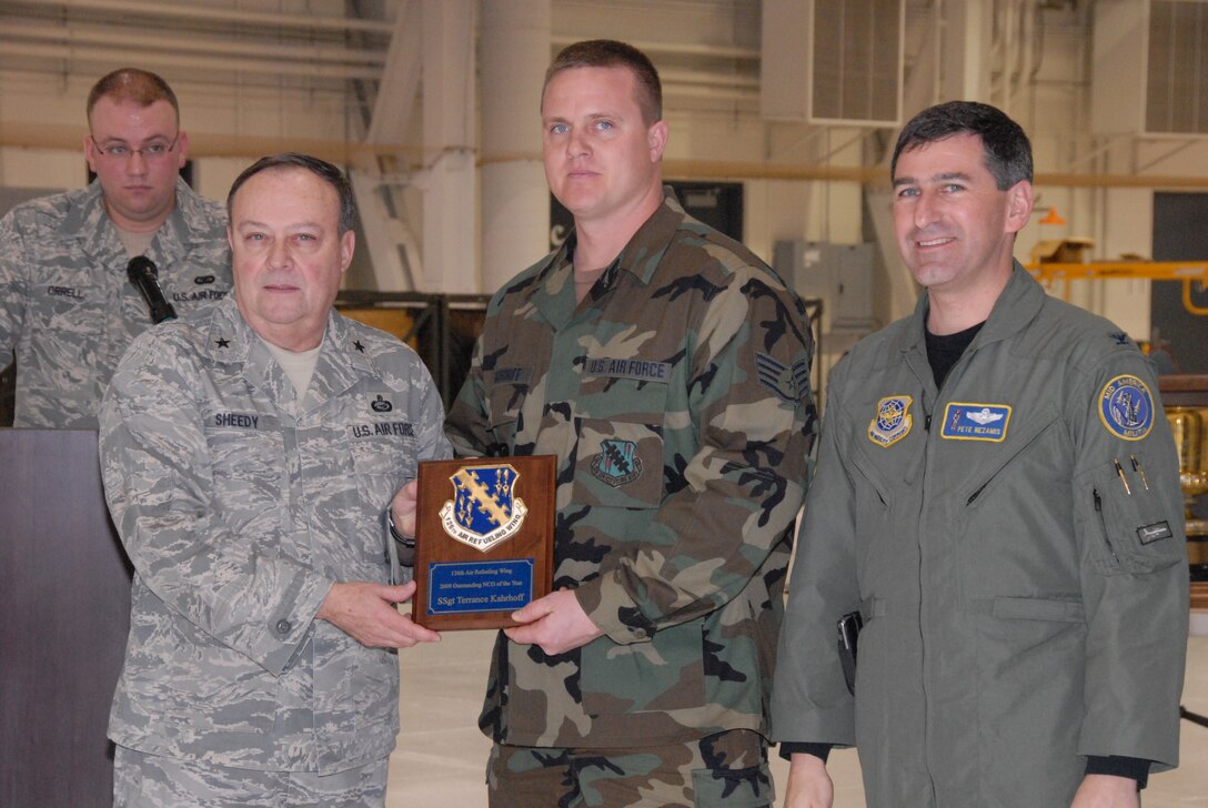 SCOTT AIR FORCE BASE, Ill. - Brig. Gen. John G. Sheedy, Assistant Adjutant General for Air and the Commander of the Illinois Air National Guard, and Col. Peter Nezamis, Commander of the 126th Air Refueling Wing, award Staff Sgt. Terrance Kahrhoff, an aircraft inspection specialist with the126th Maintenance Squadron, the 2009 Outstanding Non-commissioned Officer of the Year for the 126 ARW. (U.S Air Force photo by Tech. Sgt. Mike Rice)