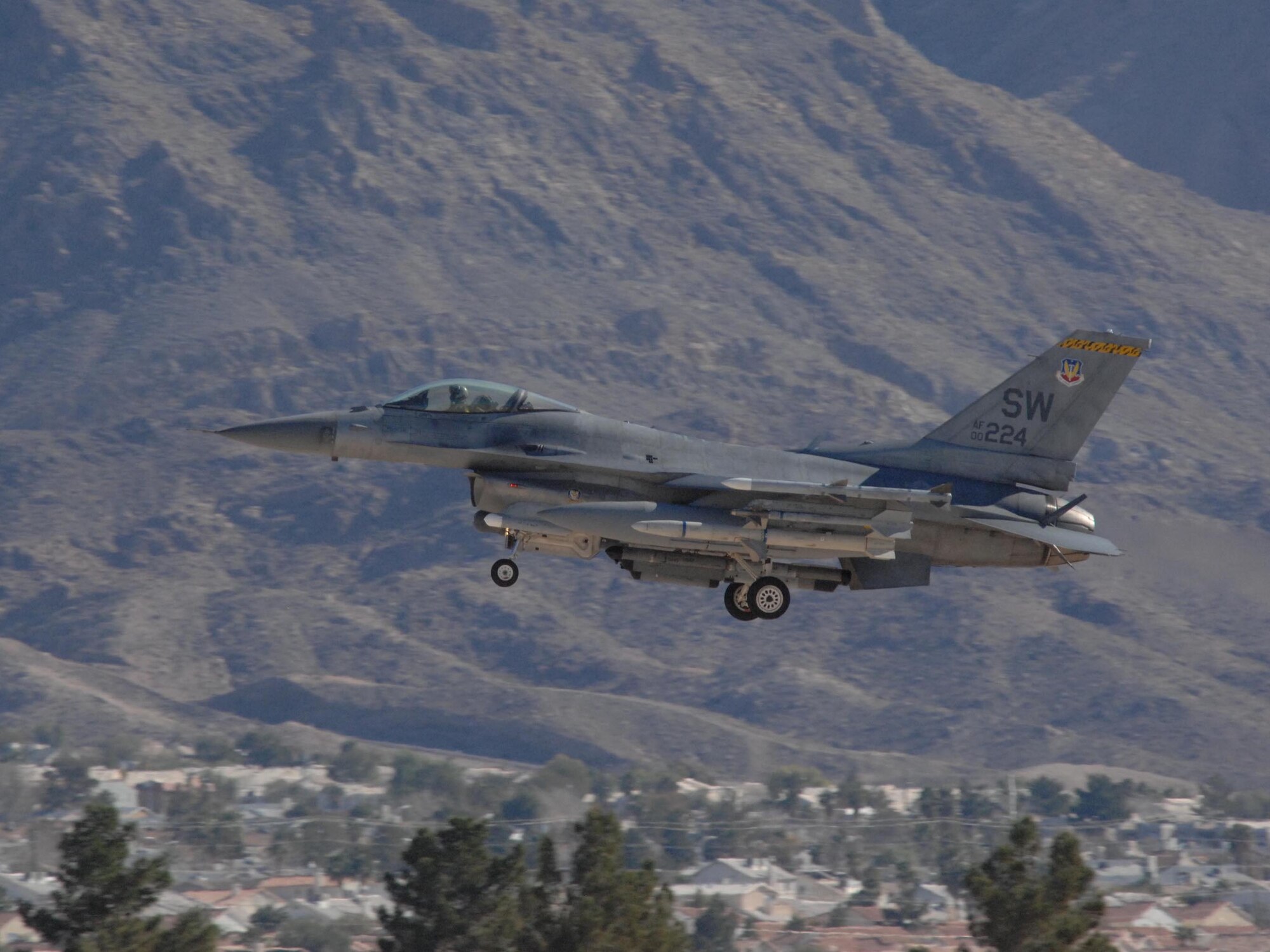 NELLIS AIR FORCE BASE, Nev. -- An F-16 pilot from the 79th Fighter Squadron, Shaw AFB, S.C., lands his jet here Jan. 28 after flying a mission for RED FLAG 09-2. RED FLAG is a multinational exercise providing a realistic environment to practice combat. The experience gained during the exercise is vital to pilots' survival. (USAF Photo by 2nd Lt Noelle Caldwell) Released