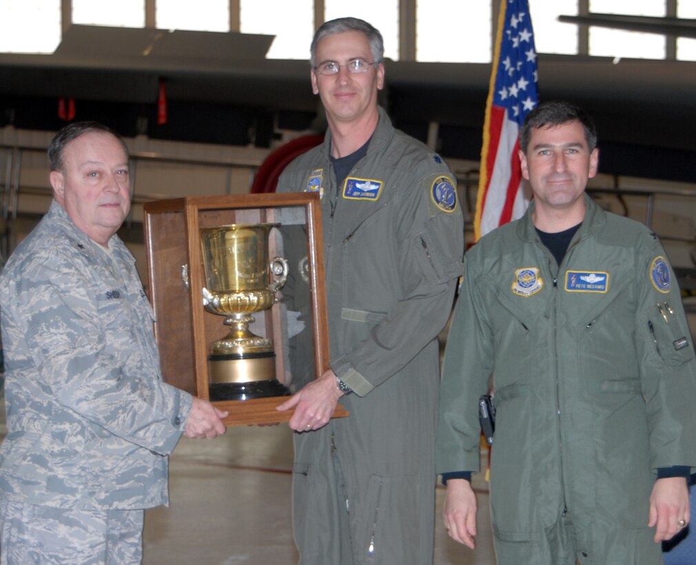 SCOTT AIR FORCE BASE, Ill. - Brig. Gen. John G. Sheedy, Assistant Adjutant General for Air and the Commander of the Illinois Air National Guard, and Col. Peter Nezamis, Commander of the 126th Air Refueling Wing Scott AFB, Ill., present the Wilson V. Newhall Safety Award to Lt. Col. Jeff Jacobson, the 126 ARW Chief of Safety. The Newhall Award was  established in honor of the late Maj. Gen. Wilson V. Newhall’s 35 years of outstanding service in the IL ANG. Each year, the Director of Operations and Assistant Adjutant General for Air for the IL ANG, review each IL ANG unit’s flight safety record to include sorties flown, mishap rate, and contribution/improvements to safety.  This is the second consecutive year that the 126 ARW has won the Newhall Flying Safety Award.  (U.S Air Force photo by Master Sgt.Franklin Hayes)