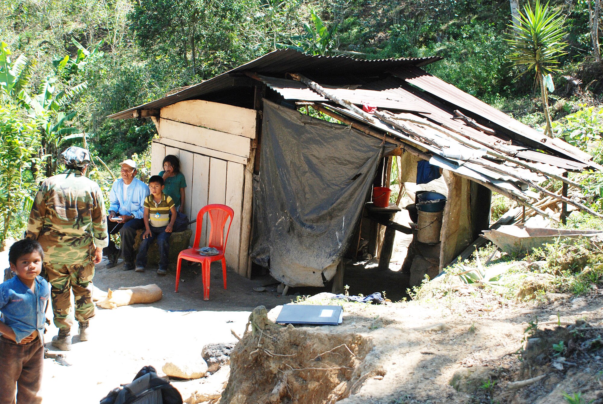 Members of the pediatric nutrition team participating in a U.S. medical readiness training exercise visit the home of a family of eight in the remote village of Marcala, Honduras. Many local residents in the mountains live without electric power or indoor plumbing, and do not have routine access to medical care. (U.S. Air Force photo/Tech. Sgt. Mike Hammond)