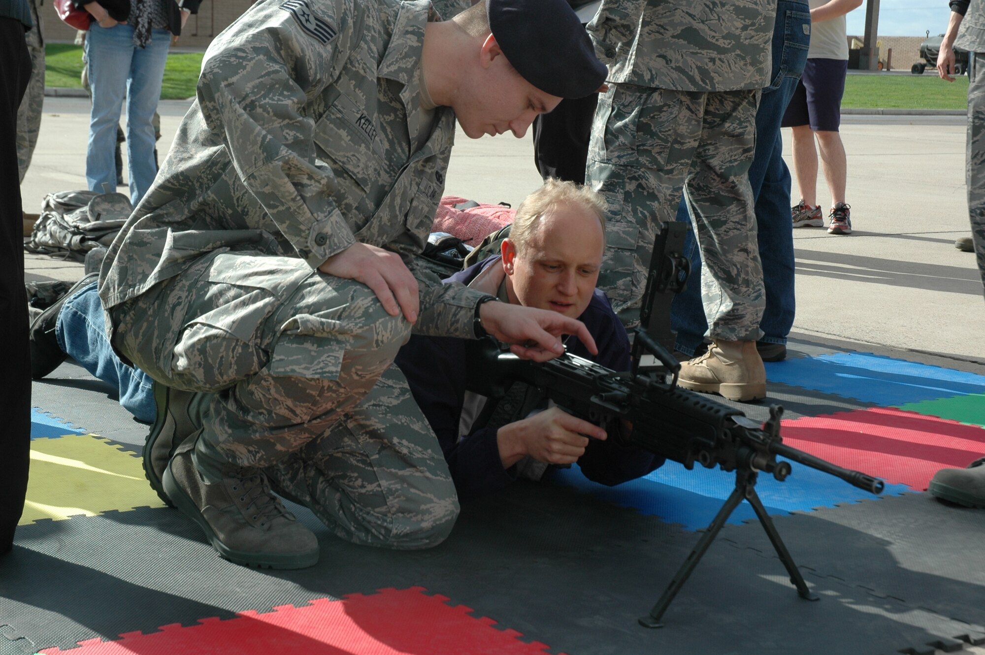 Ralf Brabandt, employee with the Wigwam Golf Resort and Spa, learns about the weapons systems and equipment used by security forces personnel during the 944th Fighter Wing's annual Bosses Day Feb. 7. (U.S. Air Force photo/Tech. Sgt. Susan Stout) 