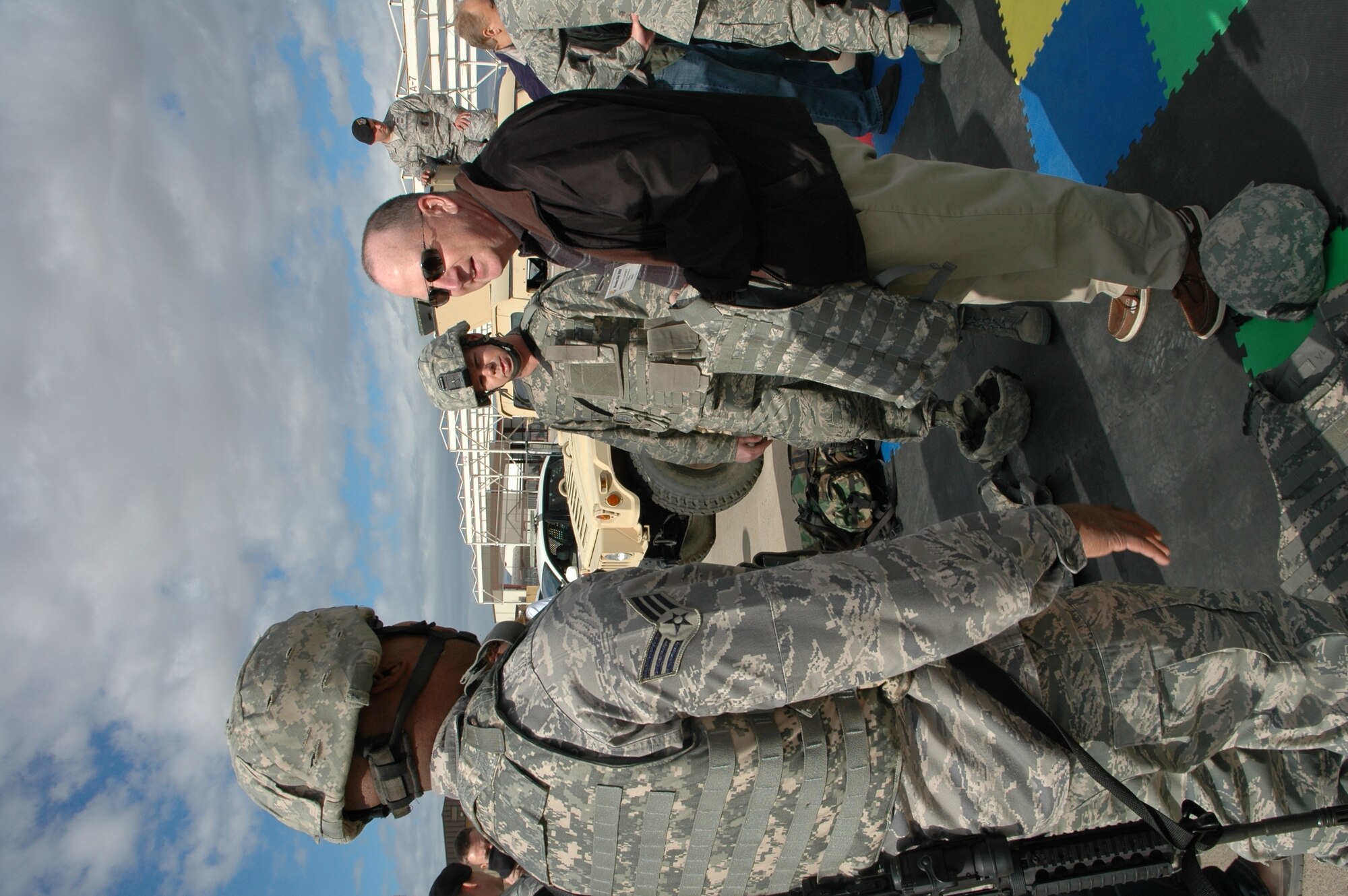 Benedict Carney, employee with the Department of Veterans Affairs in Phoenix, learns about the weapons systems and equipment used by security forces personnel during the 944th Fighter Wing's annual Bosses Day Feb. 7. (U.S. Air Force photo/Tech. Sgt. Susan Stout) 