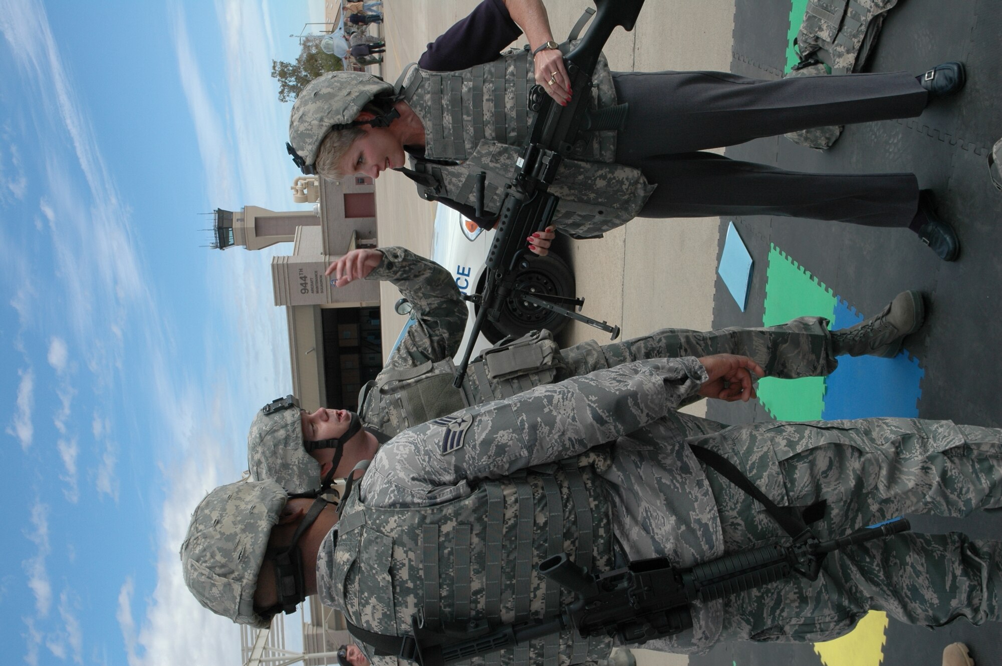 Sandee Denomme, employee with USAA, learns about the weapons systems and equipment used by security forces personnel during the 944th Fighter Wing's annual Bosses Day Feb. 7. (U.S. Air Force photo/Tech. Sgt. Susan Stout) 