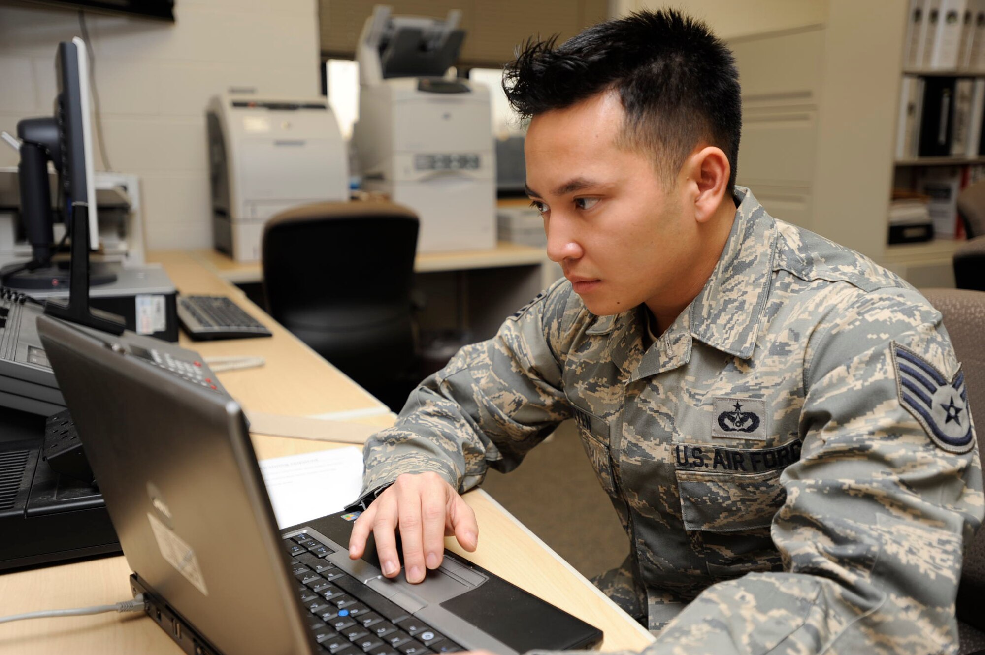 Staff Sgt. Khoa Nguyen gets some computer work done during the 931st Air Refueling Group's drill weekend in February. Sergeant Nguyen was an active-duty firefighter for the Air Force before recently joining the 931st's Civil Engineer Squadron. The 931st is an Air Force Reserve unit at McConnell Air Force Base, Kan. (U.S. Air Force photo/Tech. Sgt. Jason Schaap) 