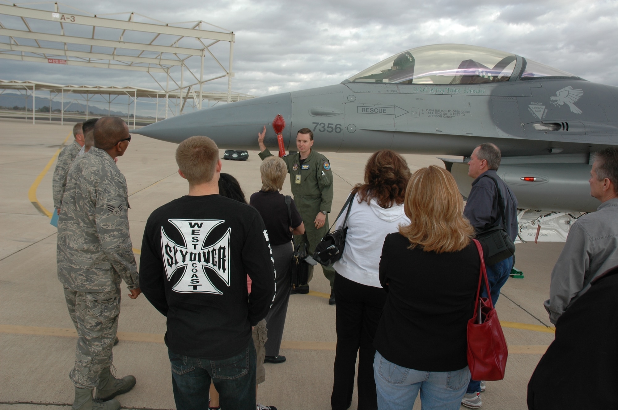 Capt. Michael Meyer, 301st Fighter Squadron instructor pilot, describes the F-16's capabilities to a group of employers Feb. 7 during Bosses Day. (U.S. Air Force photo/Tech. Sgt. Susan Stout)