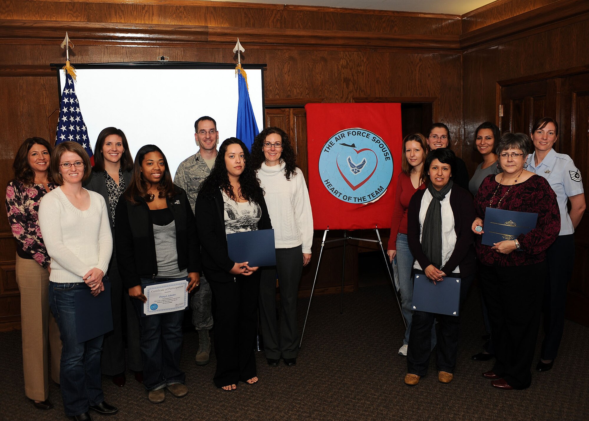 Attendees of the Heartlink seminar pose for a picture with the 49th Mission Support Group commander, Col. Steven DiFonzo, at the Officer's Club at Holloman Air Force Base, N.M., Jan. 27. Heartlink provides Holloman spouses a chance to learn about the Air Force and meet new people.(U.S. Air Force photo/Airman 1st Class DeAndre Curtiss)