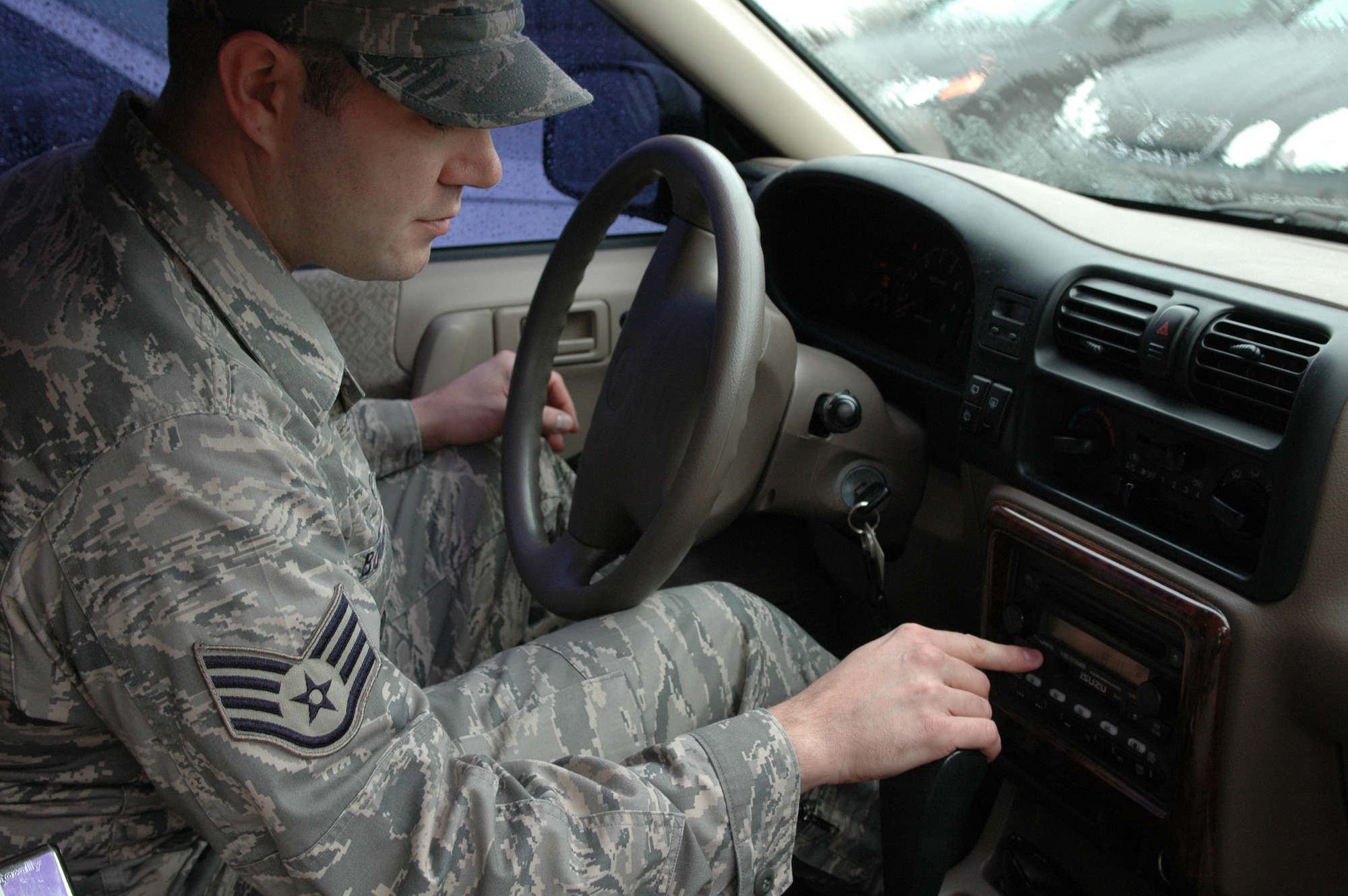 Staff Sgt. Trinity Bolman from the 60th Air Mobility Wing Ground Safety Office tunes his car's radio to AM 890 Golden Bear Radio. The station provides listeners with updated base events and activites. As a new media to Travis, the station serves as another avenue to keep members of Team Travis informed. (U.S. Air Force photo/Staff Sgt. Shaun Emery)