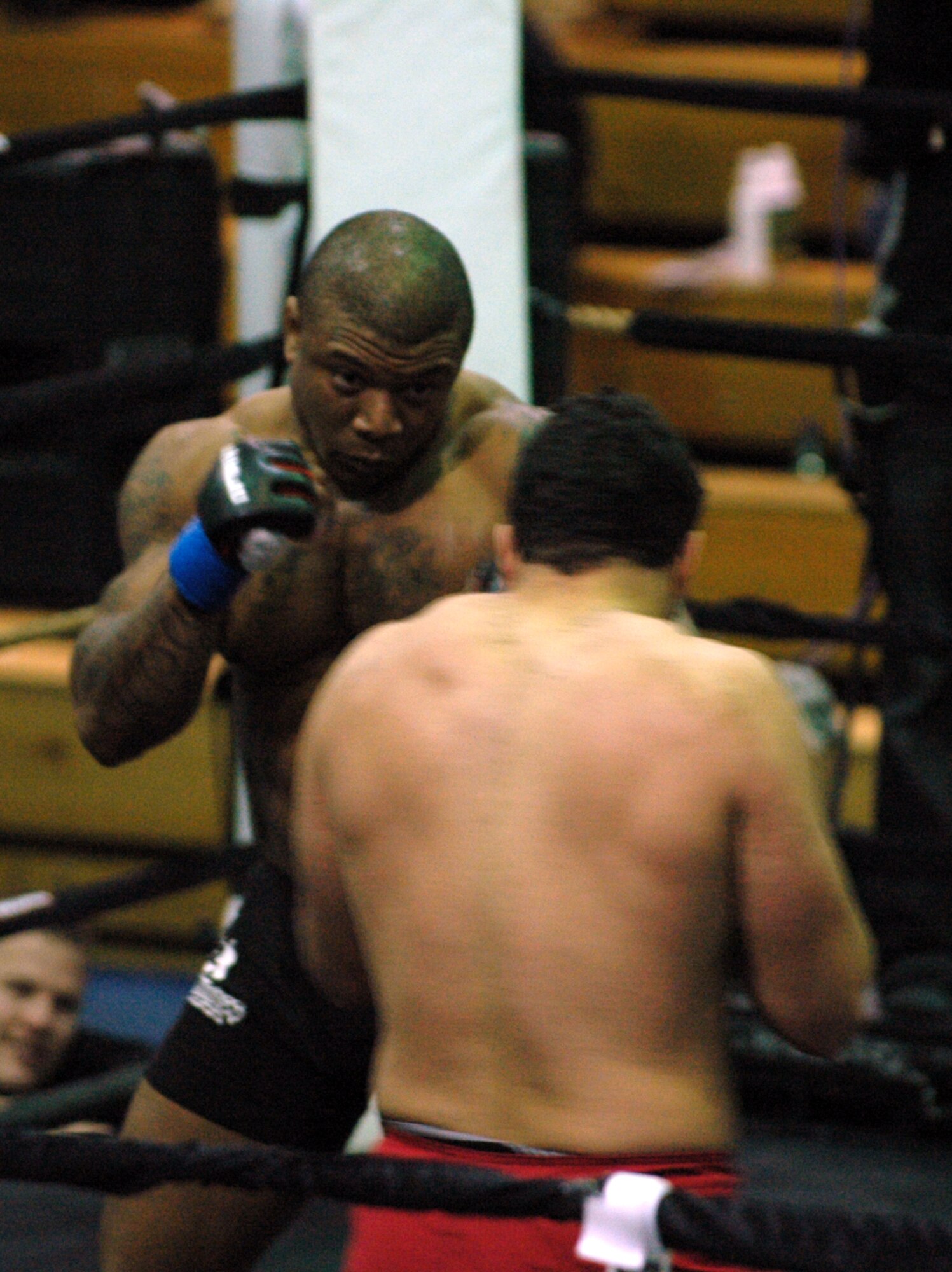 Terry "No Mercy" Broughton goes head to head against his opponent in the main event of Travis Fury, Feb. 7 at the Travis Fitness Center. Broughton is a military dependent at Travis. Broughtons lost his fight in a split decision. (U.S. Air Force photo/Staff Sgt. Shaun Emery)