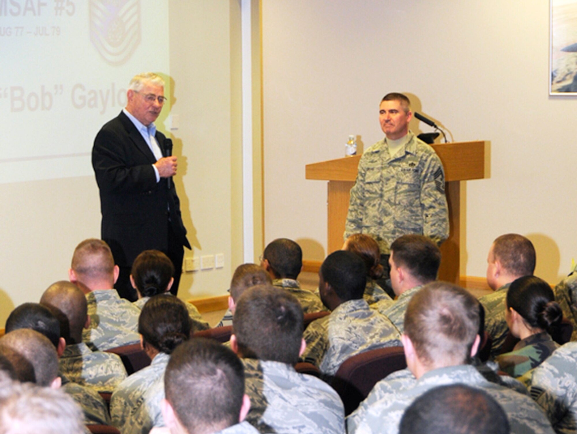 Chief Master Sgt. (Ret.) Robert Gaylor, fifth Chief Master Sgt. of the Air Force, and Chief Master Sgt. James Lucas, 48th Fighter Wing command chief, share the stage at an Airmen's call Feb. 6 at RAF Lakenheath, England. Chief Gaylor paid the 48th FW a visit to speak with Airmen and attend an Airman Leadership School graduation and Chief Induction Ceremony. (U.S. Air Force photo by Airman 1st Class Torri K. Larson)