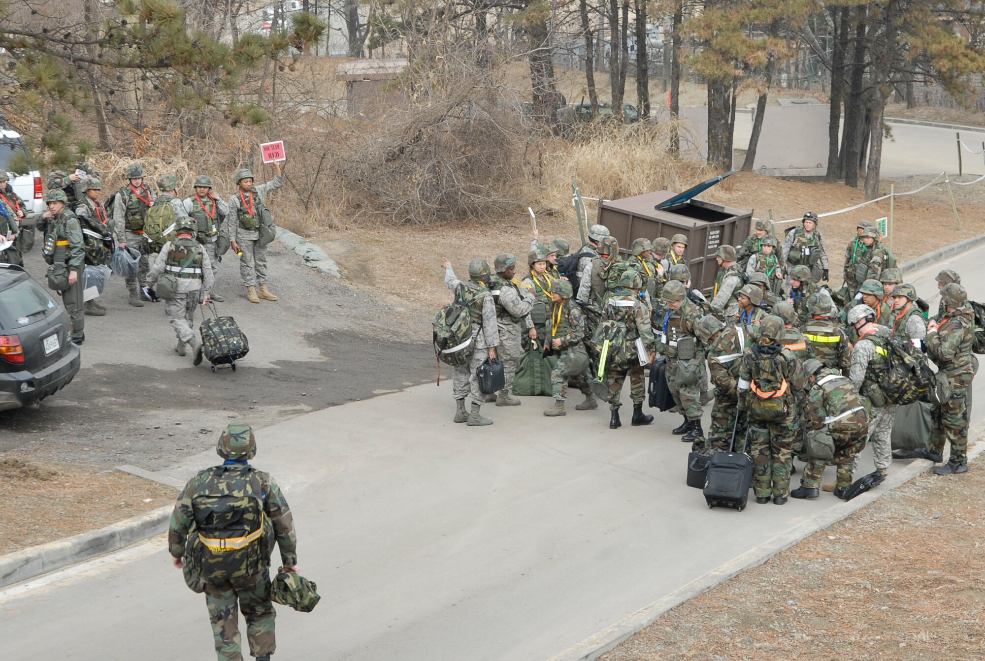 Airmen from the 51st Fighter Wing Emergency Operations center assemble at pre-designated rally points after a simulated fire forces them to conduct a "Bug-out" of the emergency operations center during the 51st Fighter Wing Operational Readiness Exercise Beverly Midnight 09-01 at Osan AB, Republic of Korea, Feb. 8.  "Bug-out" drills are conducted to demonstrate the effectiveness of building occupants to evacuate quickly from a building as quickly and safely as possible. Once accountability is conducted, the emergency operations center Airmen were able to proceeded to their alternate location. (US Air Force photo by Staff Sgt. Scottie T. McCord)