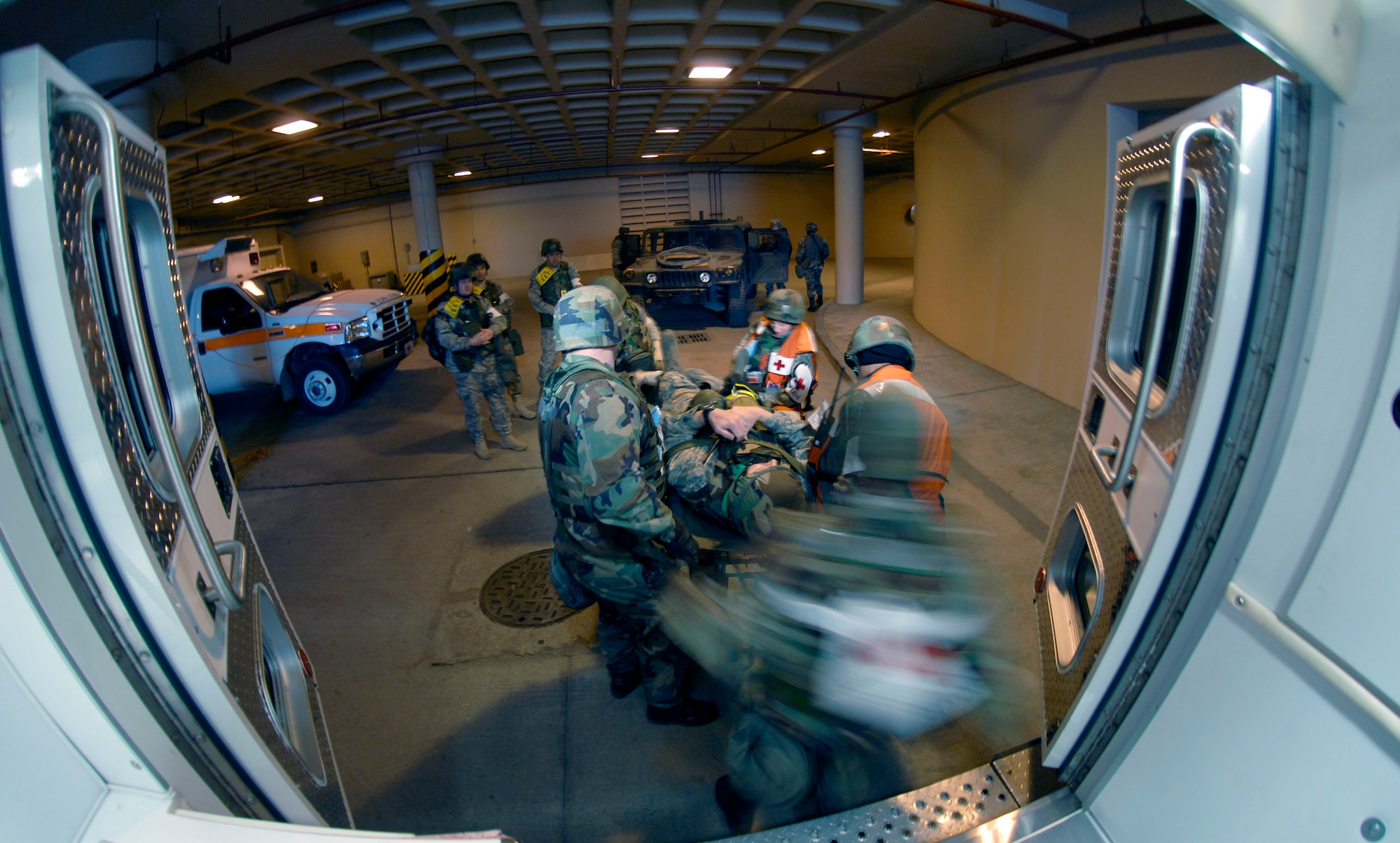 Airmen from the  51st Medical Group unload Col. Thomas Deale at the base hospital to treat his simulated broken leg,  during the 51 FW Operational Readiness Exercise Beverly Midnight 09-01 at Osan AB, Republic of Korea Feb 09. Colonel Deale is the 51st FW Commander. (US Air Force photo by Staff Sgt. Brian Ferguson) 