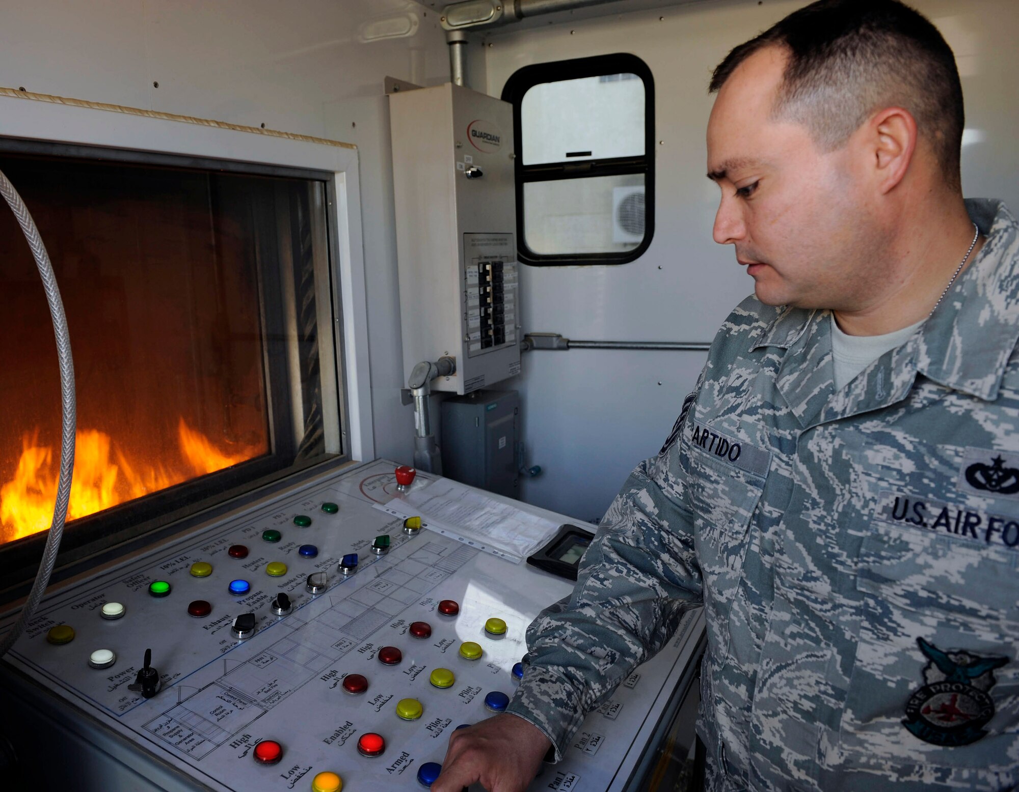 Tech. Sgt. Brian Partido starts the fire training simulator at the school house in Baghdad, Iraq, Feb. 5. Sergeant Partido is an Air Force advisor training the Iraqi air force and the Iraqi Civil Defense on basic firefighter. The Firefighters Managers Course is a 10-day class that covers general fire management, safety precaution, fire inspection, fire investigation and incident management system. Sergeant Partido is a 821st Basic Technical Training Squadron Coalition Air Force Training Team fire rescue advisor. (U.S. Air Force photo/Senior Airman Jacqueline Romero)