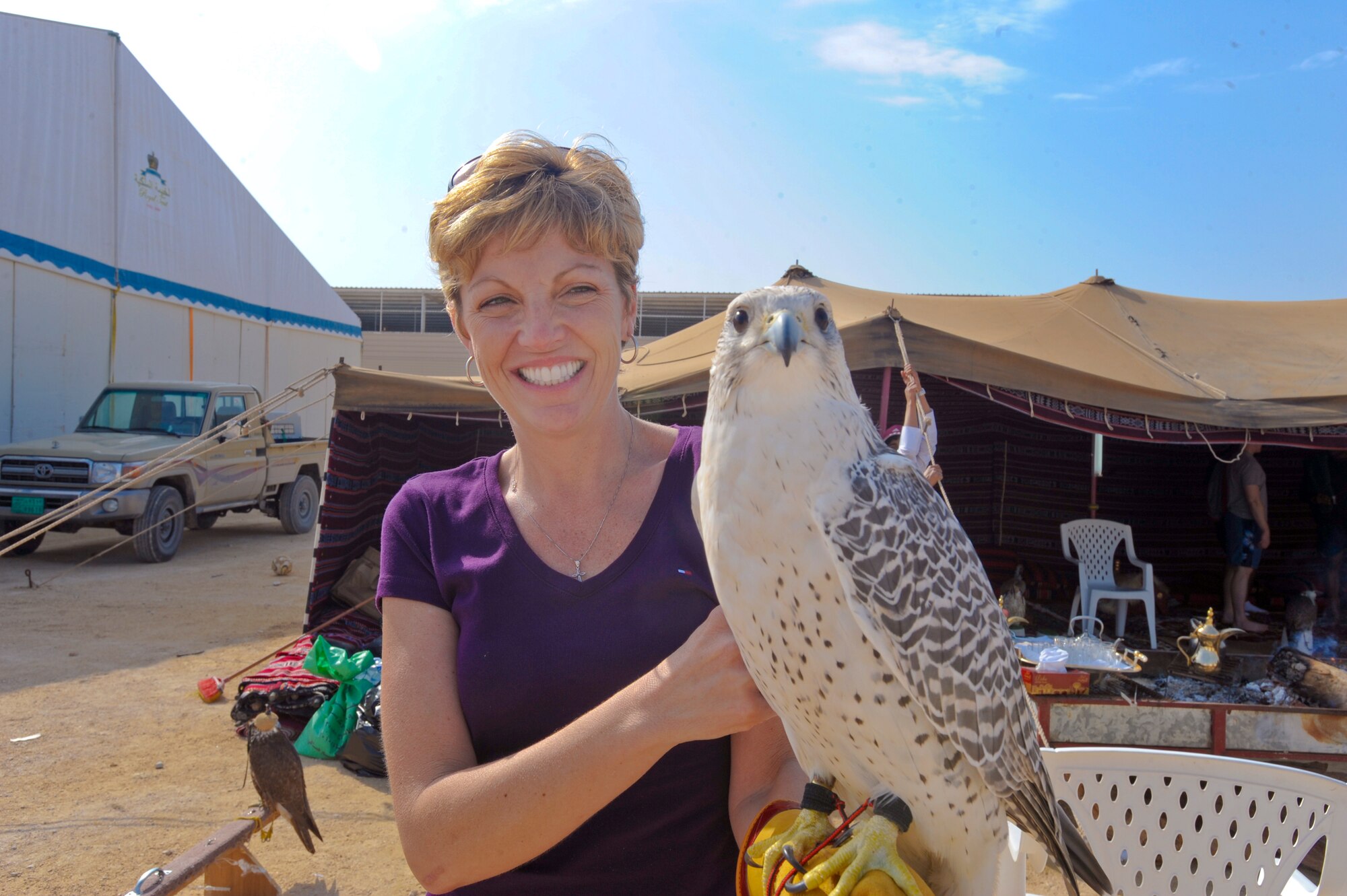 Lt. Col. Ellen Moore, of the US Air Force Special Operations Command, holds a falcon during a falconry demonstration, at a cultural exchange event, Feb. 8, 2009, in an undisclosed location in Southwest Asia.  The falcons are highly trained birds prized by local nationals and are able to fly and hunt by command.  Colonel Moore is native to Cincinnati, Ohio and is deployed from McDill Air Force Base, Fla. in support of Operations Iraqi and Enduring Freedom and Combined Joint Task Force - Horn of Africa.  (U.S. Air Force Photo by Staff Sgt. Joshua Garcia/released)      