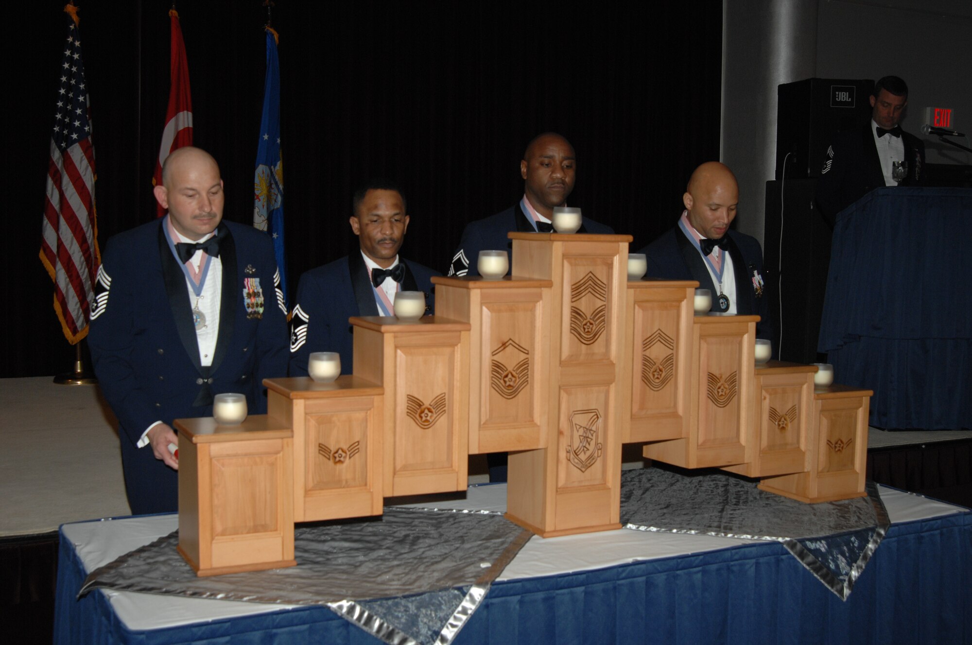 Chief Master Sgt. Michael Saltalamachia, 39th Security Forces Squadron, Senior Master Sgt. Stephen Gregory, 39th Comptroller Squadron, Senior Master Sgt. Joseph Howell, 39th Air Base Wing command post and Senior Master Sgt. Ben Roberson, 425th Air Base Group, prepare to light candles symbolizing their progression through each level in the enlisted ranks before reaching the pinnacle of chief master sergeant. The candle lighting ceremony was conducted during the chief recognition ceremony, in which Incirlik’s newly selected chiefs of 2009 are honored, at the Incirlik Combined Club, Feb. 6, Incirlik Air Base, Turkey. (U.S. Air Force photo/Senior Airman Lauren Padden) 