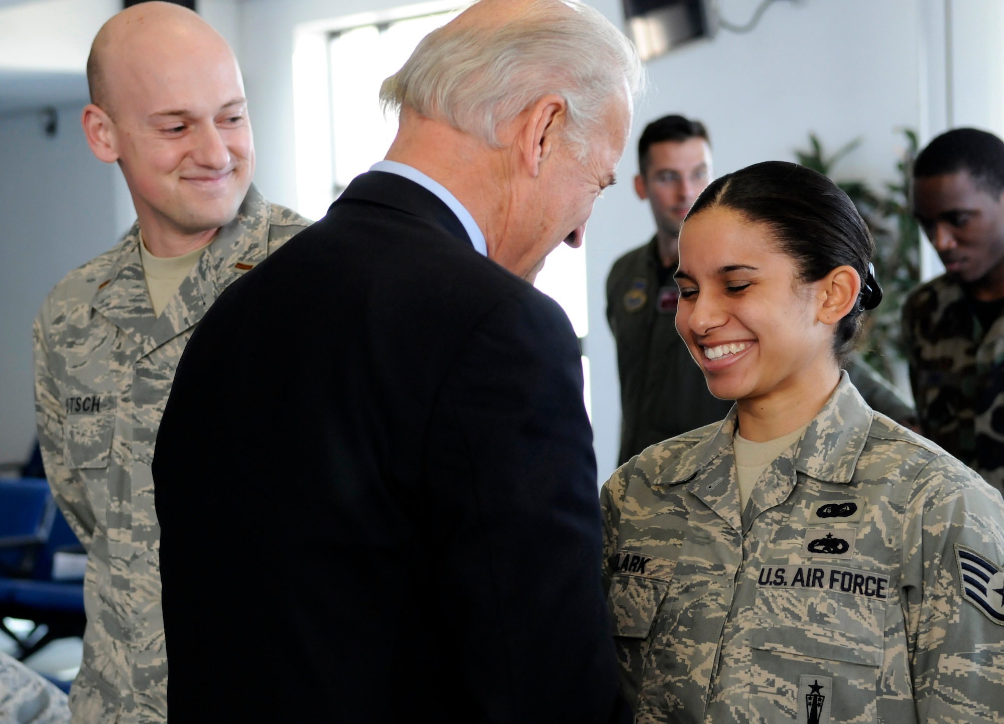 "How did you land this duty on a Sunday," joked Vice President Joe Biden to Staff Sergeant Lee Hanna Clark during a two-hour visit to RAF Mildenhall, England Feb. 8, 2009.  During his visit, Vice President Biden visited with Airmen and their families and discussed the weakened economy and what the Obama administration is doing to potentially strengthen it. (U.S. Air Force photo by Senior Airman Christopher L. Ingersoll)