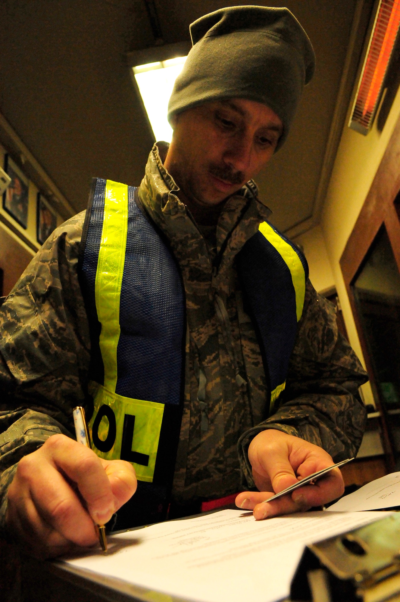 Master Sgt. David Greene, 2nd Air Postal Squadron first sergeant, documents identification information while participating in a sobriety checkpoint at Ramstein Air Base, Germany, Feb. 7, 2009. Sobriety checkpoints are being held randomly throughout the Kaiserslautern Military Community in an effort to enforce a zero tolerance policy against driving under the influence of drugs and alcohol. 

(U.S. Air Force photo by Staff Sgt. Stephen J. Otero) 
